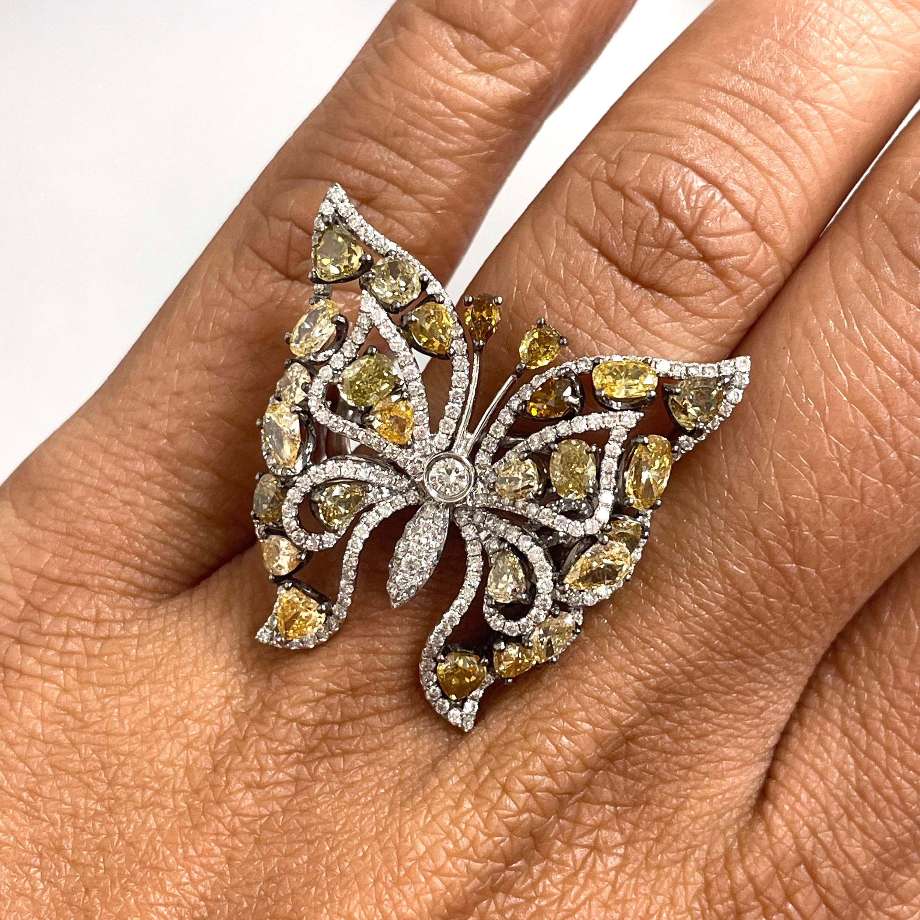 The vibrant colors of this one of a kind butterfly ring make it an ideal statement ring for any celebration.

Diamonds Shapes: Pear Shape, Oval, Cushion & Trillion 
Diamonds Weight: 3.80 ct 
Diamonds Color: Fancy Orange, Green, Yellow & Brown