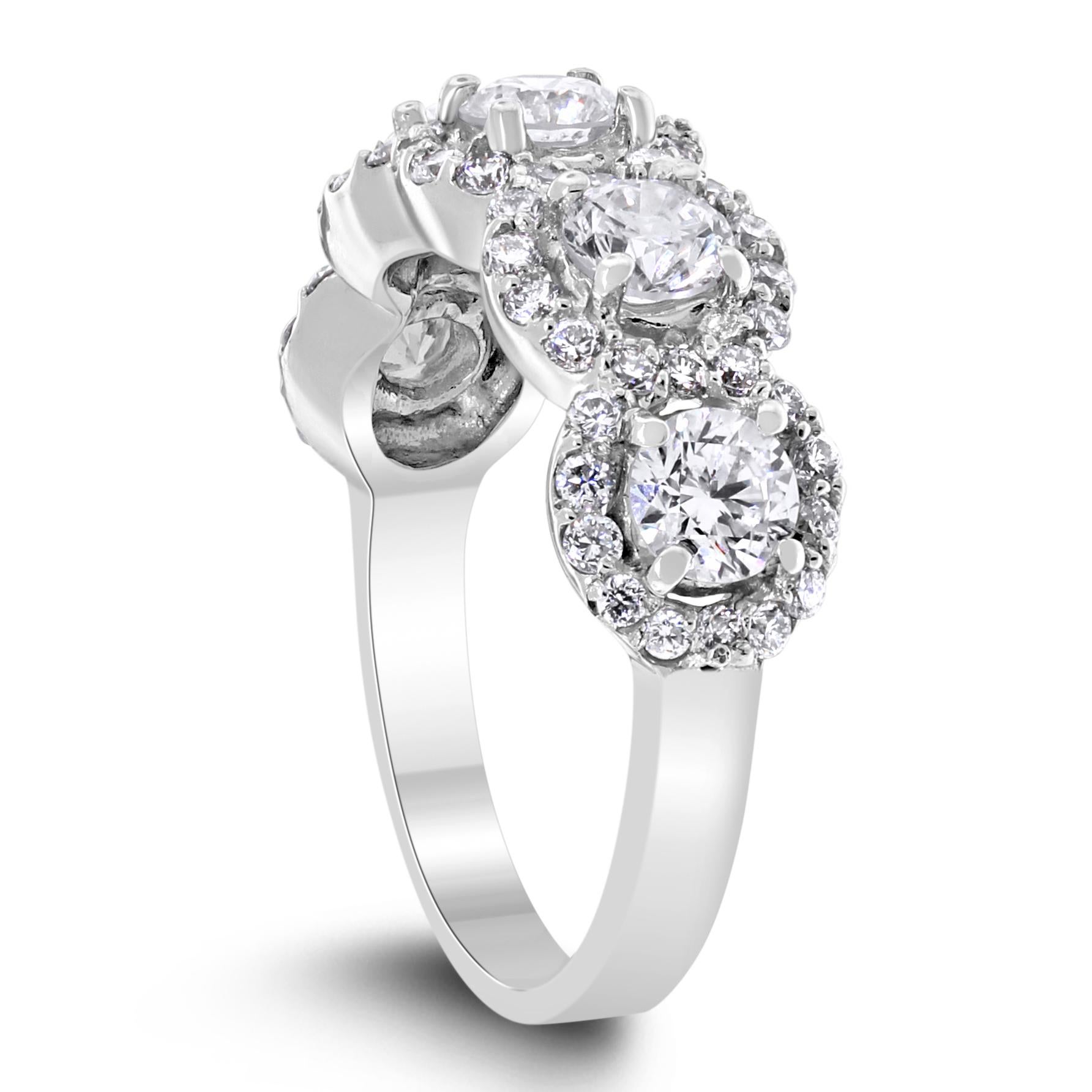 The Center of My World Band in a contemporary take on the classic 5 Diamond Band that enhances the brilliance of each of the 5 center diamonds with a halo.

Total Diamond Weight: 1.77 ct 
No. of Diamonds: 63
Average Diamond Weight: 0.03 ct 
Diamond
