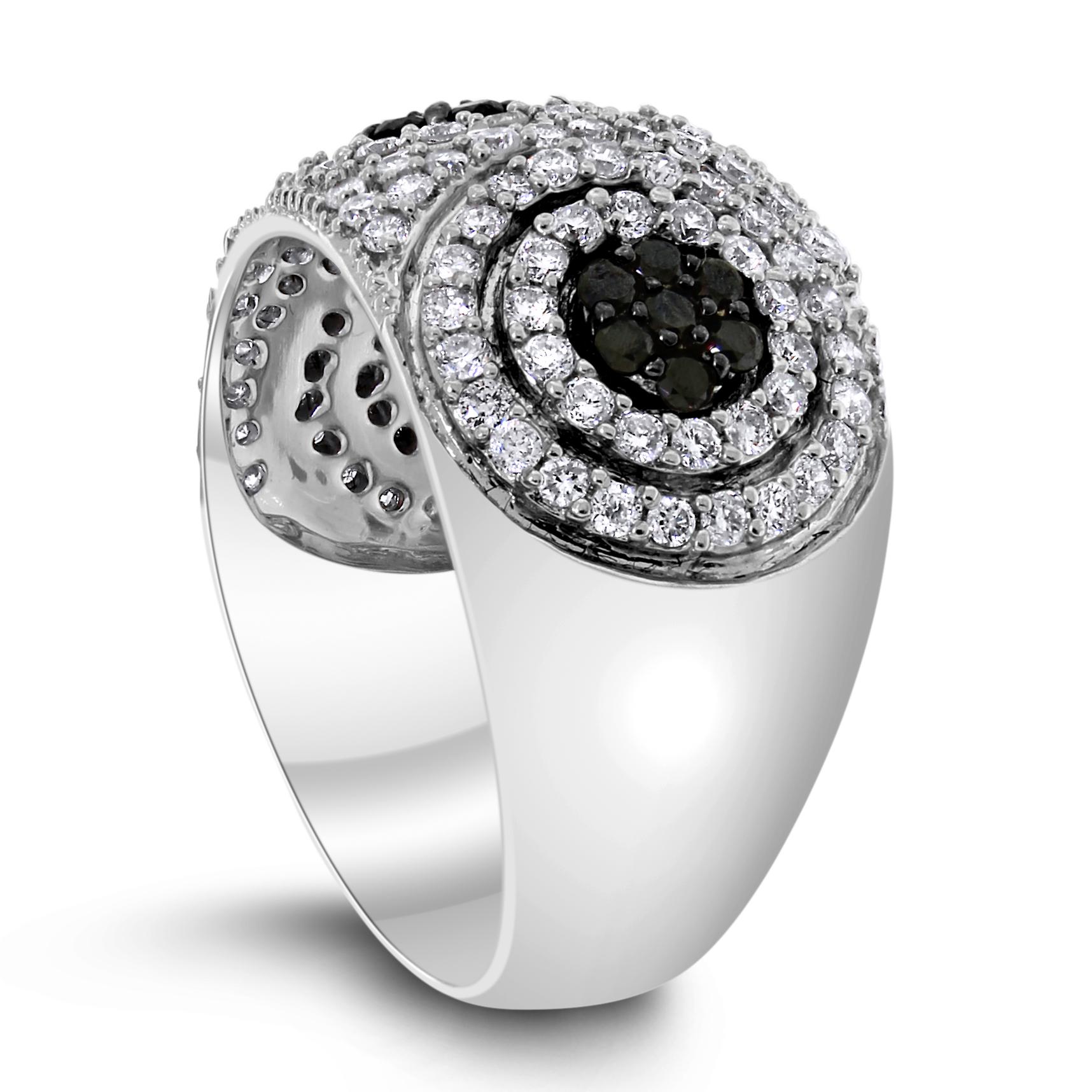 This white & black diamond band ring is all about fun and frolic.

Diamonds Shape: Round
Diamonds Weight: 0.95 ct (White) & 0.30 ct (Black)
Diamonds Color: F - G & Black
Diamonds Clarity: SI - I

Metal: 14K White Gold
Metal Wt: 6.45 gms 
Setting: