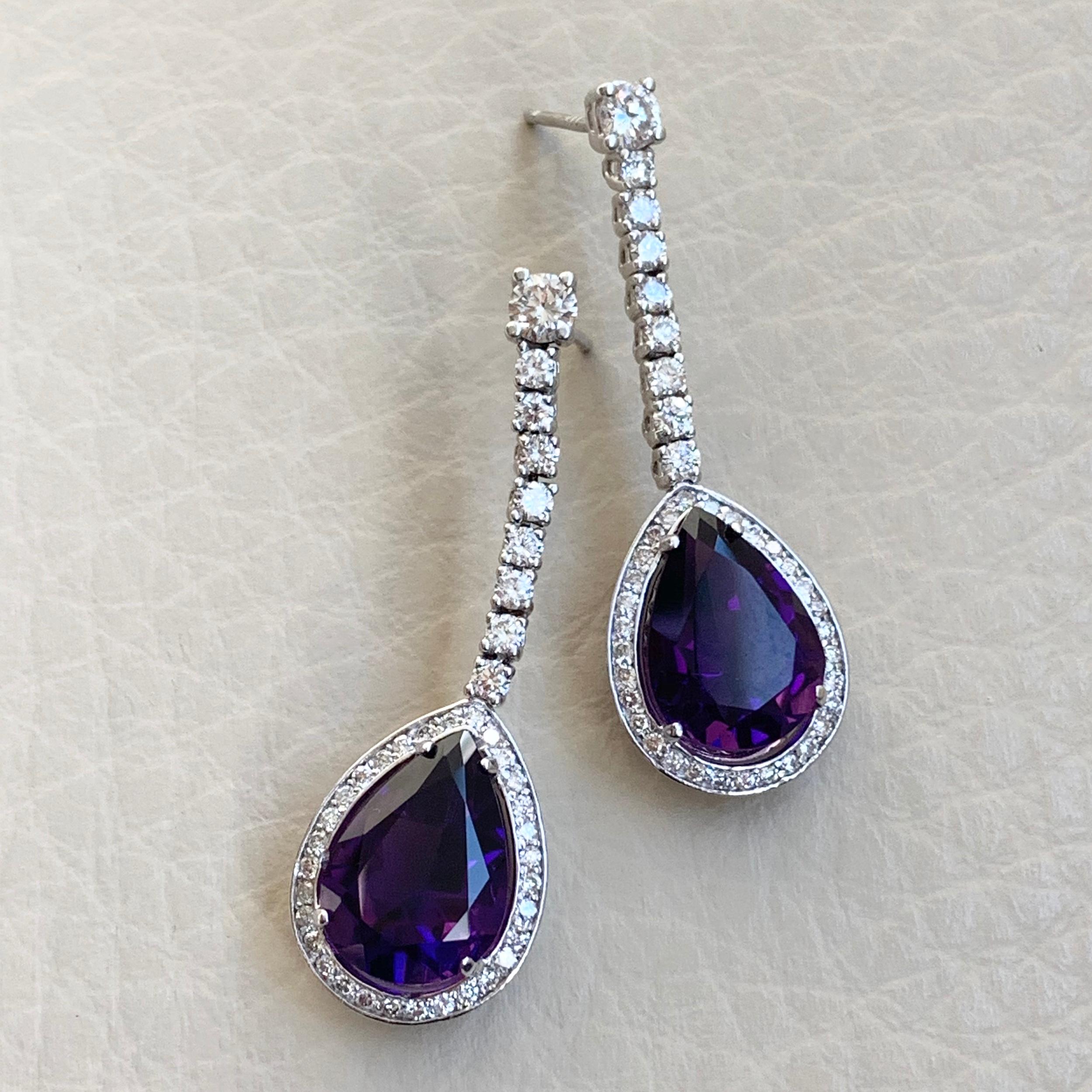 These Diamond & Amethyst Earrings showcase an elegant combination of colors and shapes. They are chic & make a bold statement. 

Gemstones Type: Amethysts 
Gemstones Shape: Pear Shape 
Gemstones Weight: 10.56 ct 
No. of Gemstones: 2 
Gemstones