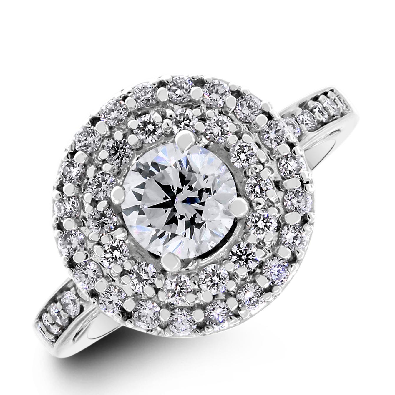 Let her know that she is the center of your world with this unique double halo solitaire diamond engagement ring with accent diamonds on the band as well as the underside of the halo.

Center Diamond Shape: Round
Center Diamond Weight: 0.80 ct