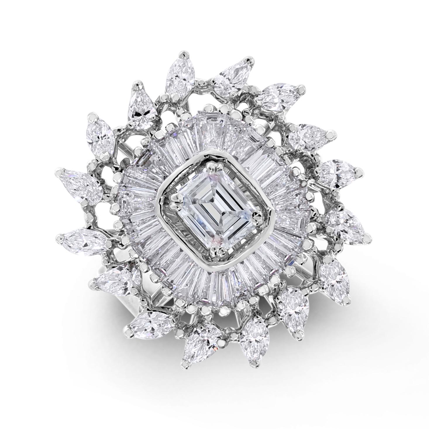 With unique combination of shapes, this diamond ring features concentric halos to create an bold & dramatic effect

Center Diamond Shape: Emerald Cut 
Center Diamond Weight: 0.61 ct 
Diamond Color: G - H 
Diamond Clarity: VS (Very Slightly Included)