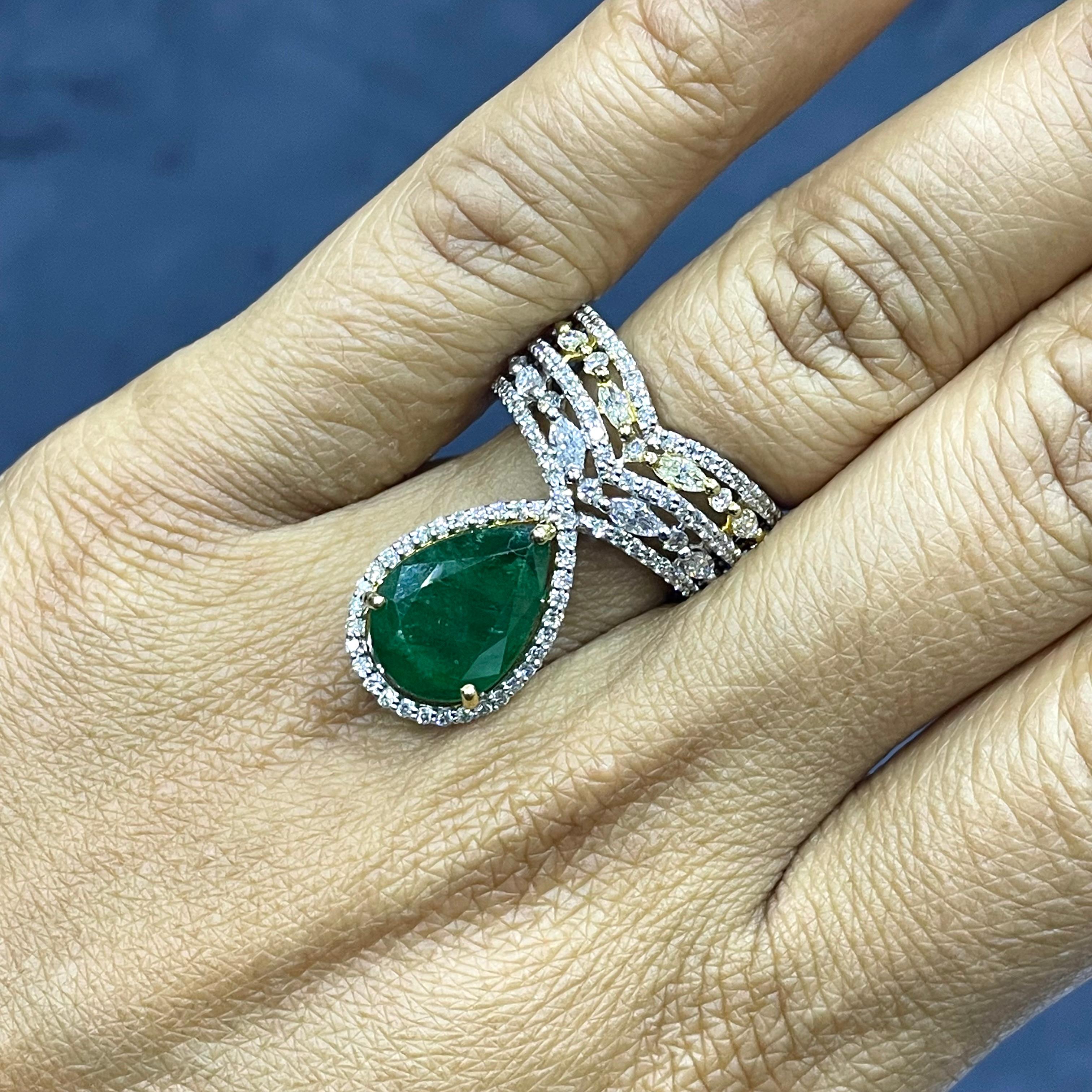 With a crown jewel structure and a mix of colors and shapes, the Danya ring is unique, sweet and attractive. 

Gemstones Type: Emerald
Gemstones Shape: Pear Shape
Gemstones Weight: 5.04 ct
Gemstones Color: Green

Diamonds Shape: Round &