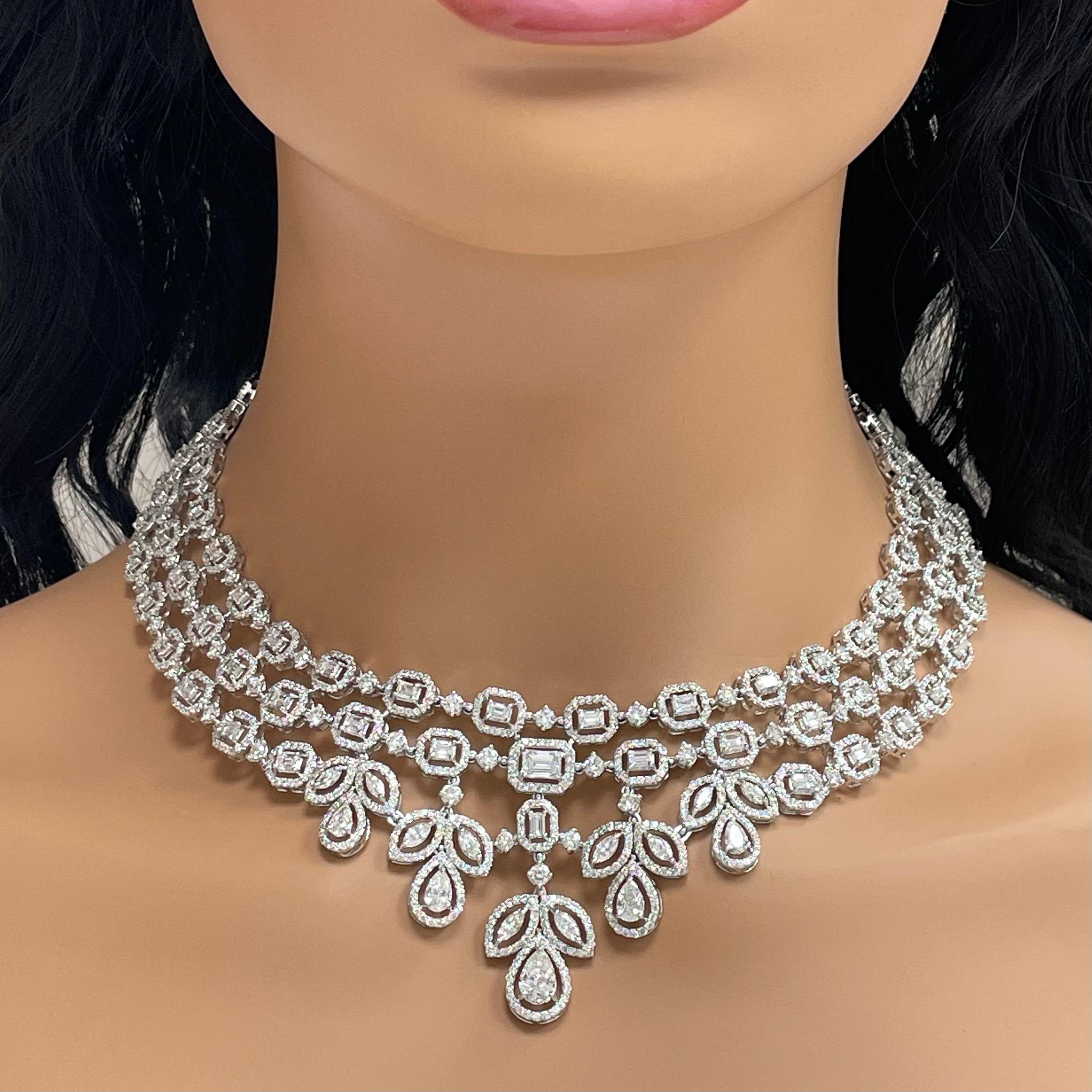 The Beauvince Legacy diamond necklace features a important and emphatic design befitting a queen. It is stated, royal & elegant.

Diamonds Shapes: Pear Shape, Marquise, Emerald & Round 
Total Diamonds Weight: 23.45 ct 
Diamonds Color: G - H