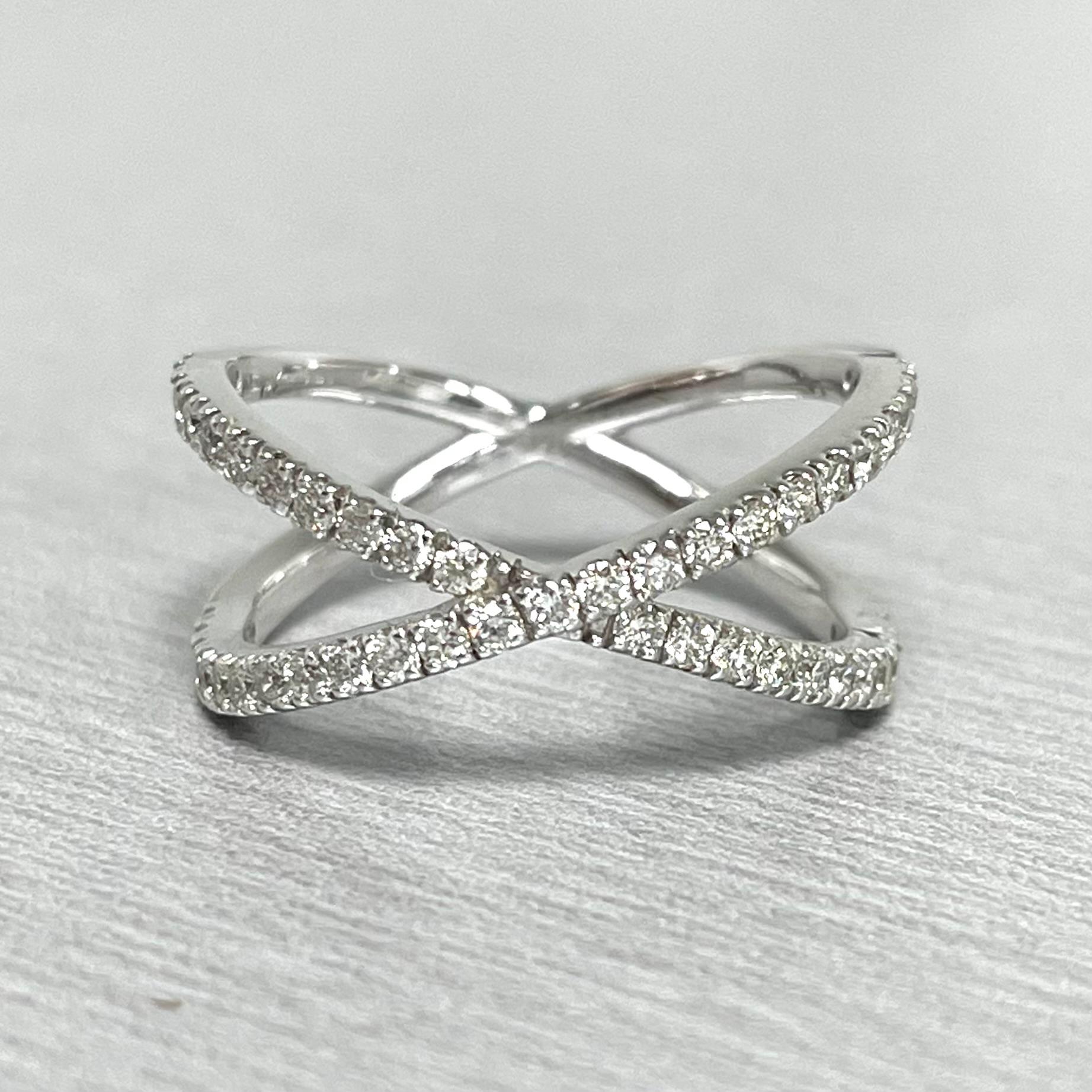 The Everyday Criss Cross Ring is a cool and fun expression of style and playfulness. It is perfect on its own, stacked with other playful rings or paired as a wedding band.

Total Diamond Weight: 0.50 ct 
Diamond Color: G - H 
Diamond Clarity: VS