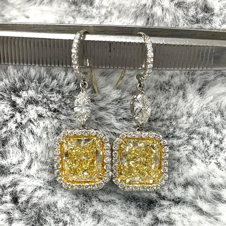 An exquisite pair of rare perfectly matched Internally Flawless Fancy Yellow (borderline intense yellow) Diamonds set in a timeless statement design, the Exuberance earrings bring a glowing smile to your face and heart.

Center Diamond Shape: