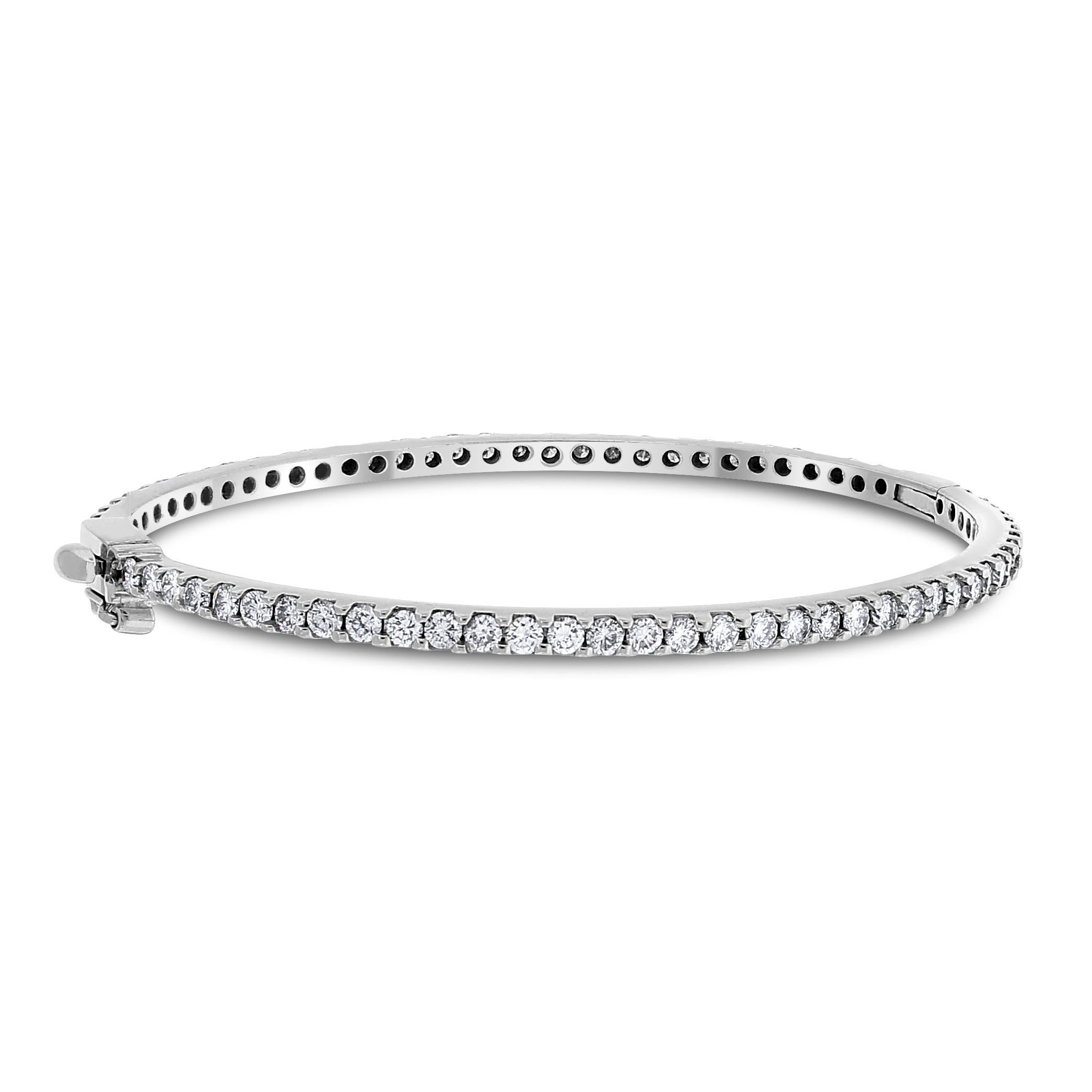 A modern take on the traditional bangle that delicately accentuates the wrist. This bangle is open-able for ease of putting on and taking off.

Total Diamond Weight: 4.00 ct 
No. of Diamonds: 71 
Diamond Color: H - I 
Diamond Clarity: VS - SI (Very