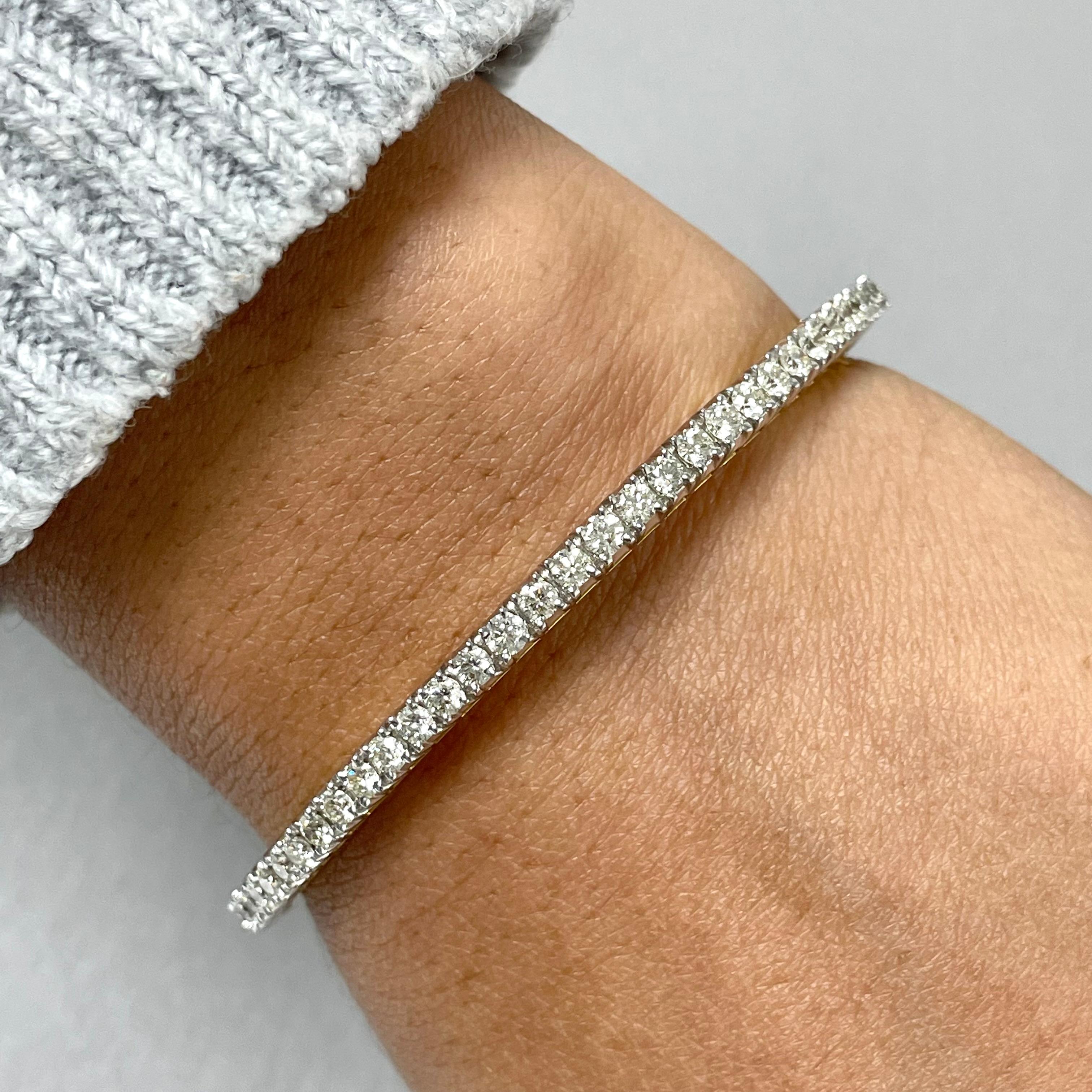 The Classic & Evergreen Bangle that delicately accentuates the wrist. This bangle is open-able for ease of putting on and taking off. 

Total Diamond Weight: 5.03 ct 
No. of Diamonds: 72 
Average Diamond Weight: 0.07 ct 
Diamond Color: H 
Diamond