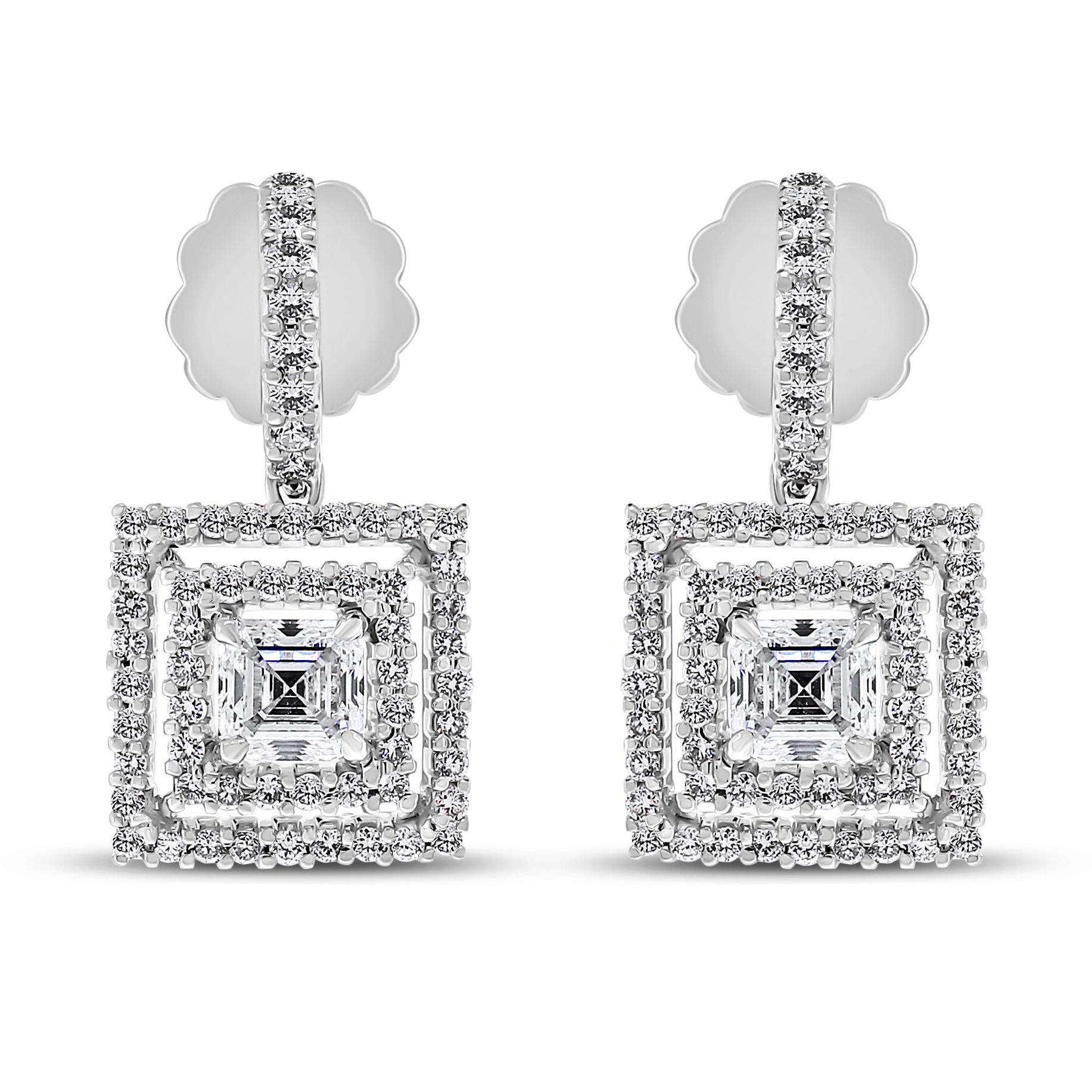 The Gatbsy Diamond Earrings & Pendant Set is bold and chic. With its strong lines and geometric shapes it stands out leaving the onlooker dazzled. 

Total Diamond Weight: 3.89 ct (2.22 ct Asscher Cut + 1.67 ct Round Diamonds) 
Diamond Color: G -