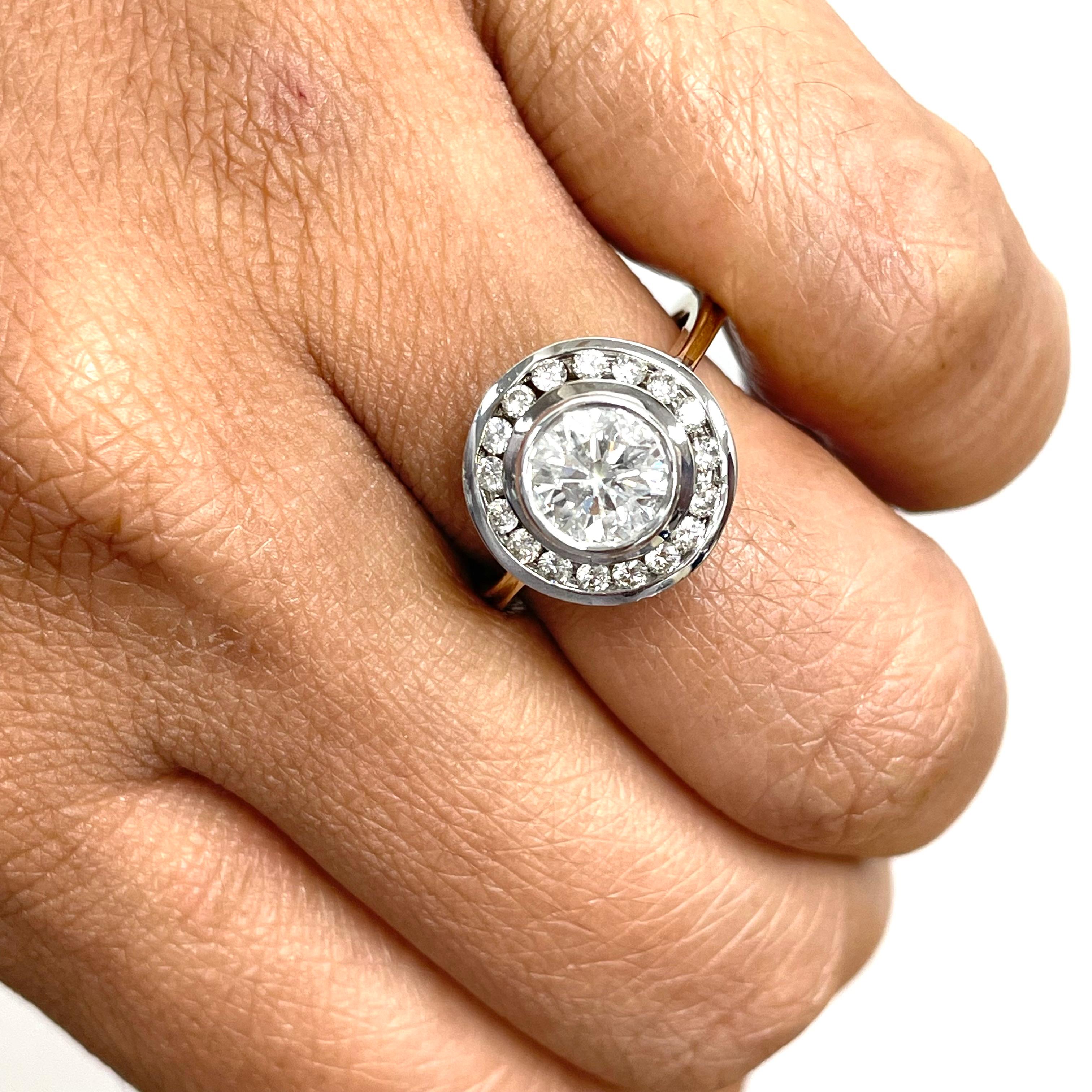 The Generations Ring is a unique ring that simultaneously brings together a antique and modern flair via two tone gold and channel set diamonds. 

Center Diamond Shape: Round 
Center Diamond Weight: 1.06 ct 
Diamond Color: F
Diamond Clarity: I1