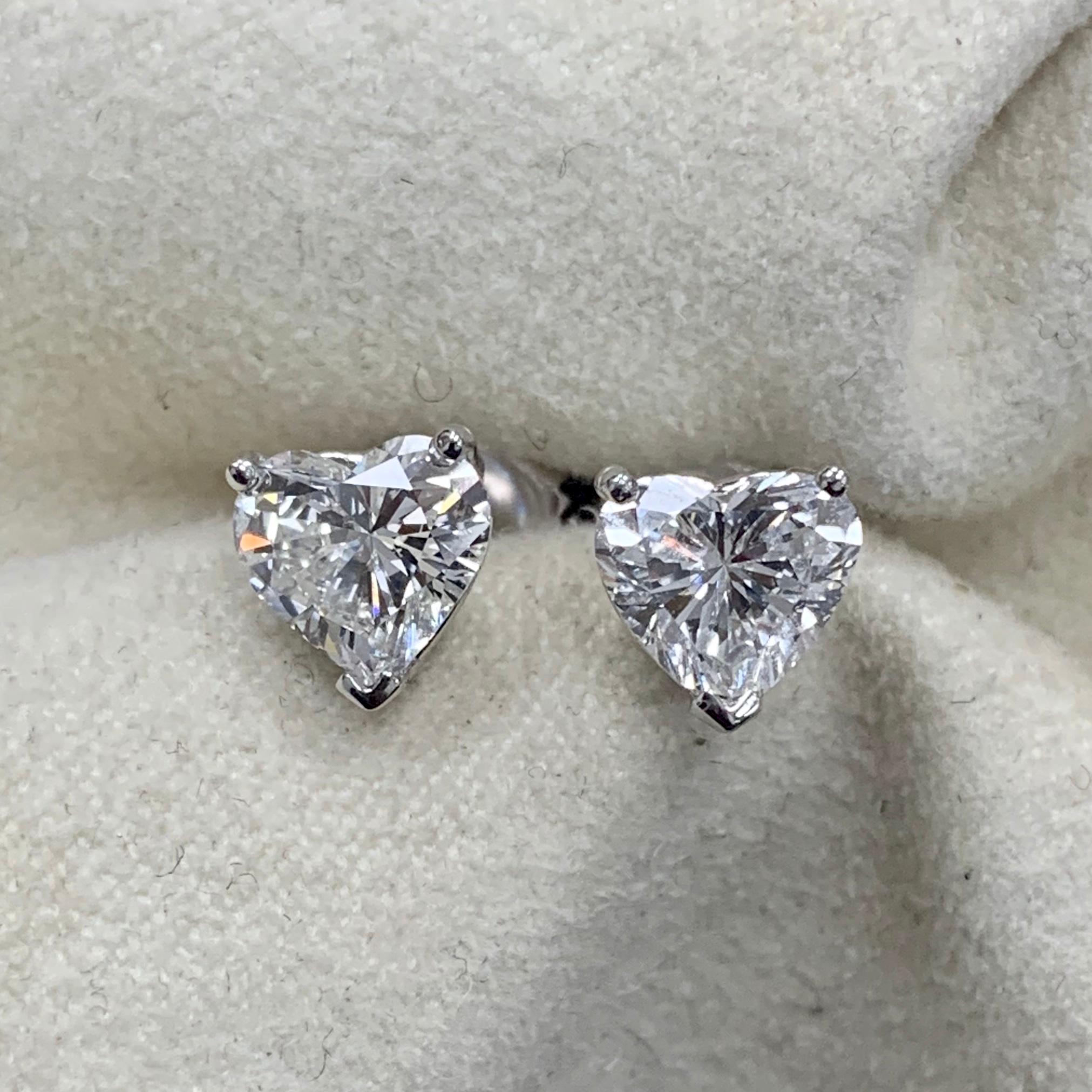 Diamond solitaire studs are a signature everyday piece of jewelry. They are a classic and a statement simultaneously. 

This particular pair of Heart Shape Studs features a depth of 53.1% and 55.7% enabling it to look more like a pair of 1.5 ct each