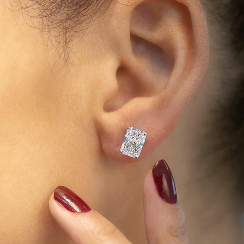 Diamond solitaire studs are a signature everyday piece of jewelry. They are a classic and a statement simultaneously. 

This particular pair of Radiant Cut studs showcases perfectly eye clean diamonds that dazzle and stand out with their unique and