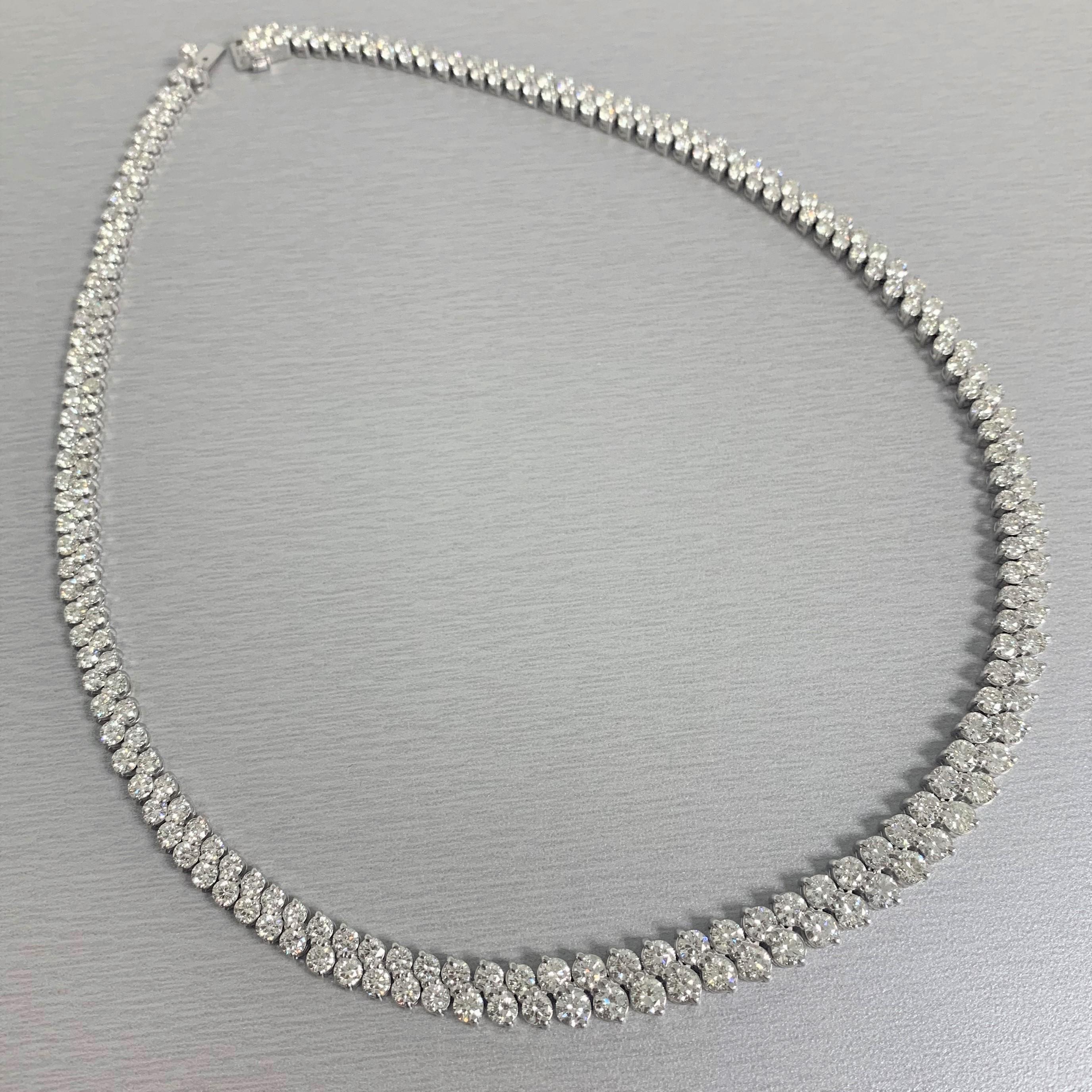 Unconventional and sassy, this Riviera Necklace is absolutely dazzling. With 2 rows of diamonds joint together at an angle, the necklace has a non traditional 'wow' to it.

Total Diamond Weight: 23.96 ct 
Diamond Color: H - J
Diamond Clarity: VS -