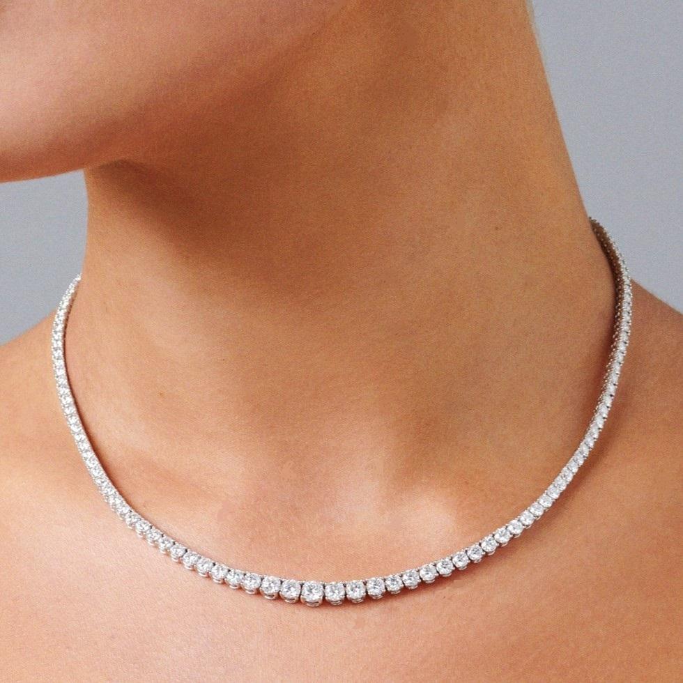 A classic and elegant everyday or occasional wear with graduating diamond sizes, this Tennis Necklace is a timeless and versatile piece of jewelry. All our necklaces have two locks for added security.

Total Diamond Weight: 12 ct 
No. of Diamonds: