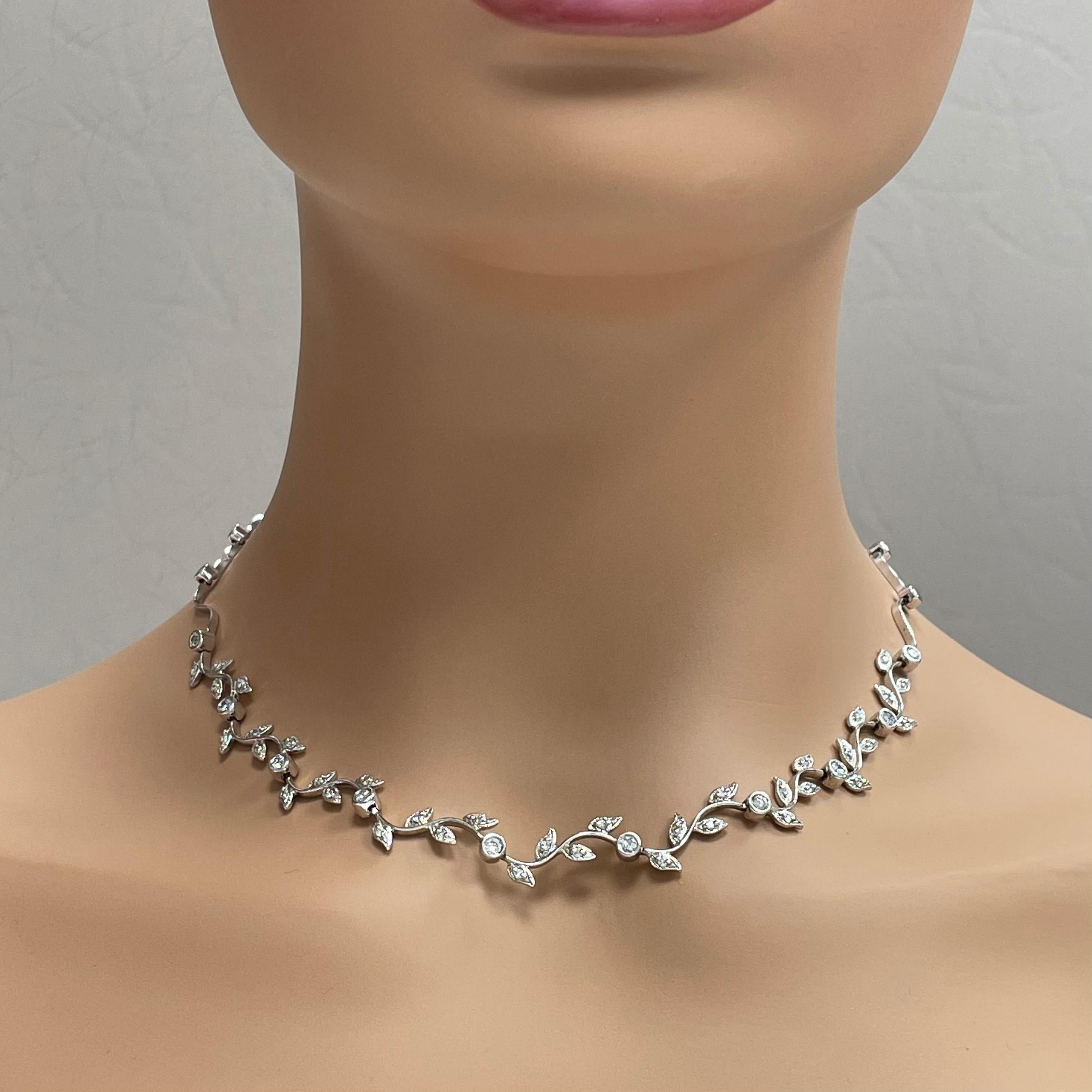 The Grape Vine Necklace is a delicate accessory that reflects a touch of nature. 

Total Diamond Weight: 1.25 ct 
Diamond Color: G - H 
Diamond Clarity: SI (Slightly Included) 

Metal: 14K White Gold 
Metal Wt: 20.00 gms 
Setting: Bezel & Prong
