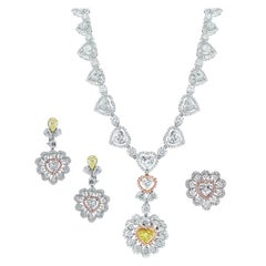 Beauvince Parure collier, boucles d'oreilles et bague cœur en or blanc et diamants