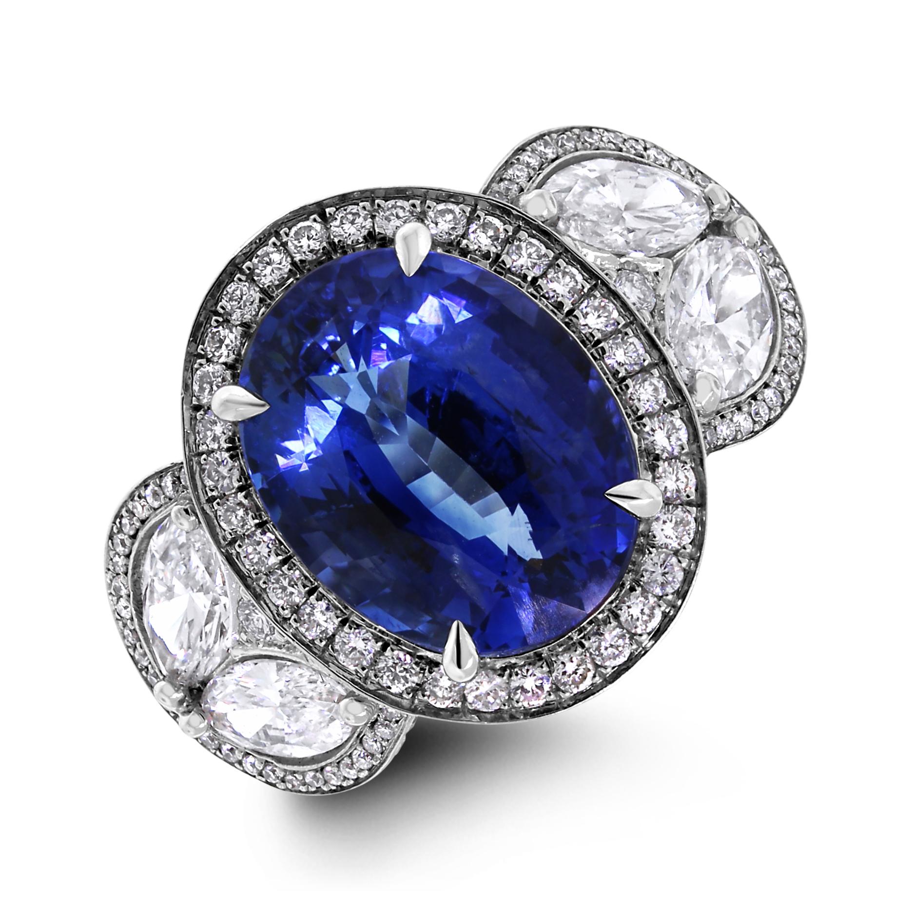 An enviable jewel, this ring sports some dazzling Diamonds & a sparkling Sapphire. 

Gemstones Type: Sapphire 
Gemstones Shape: Oval 
Gemstones Weight: 5.38 ct 
Gemstones Color: Blue  

Diamonds Shape: Round & Marquise 
Side Diamonds Weight: 2.13 ct