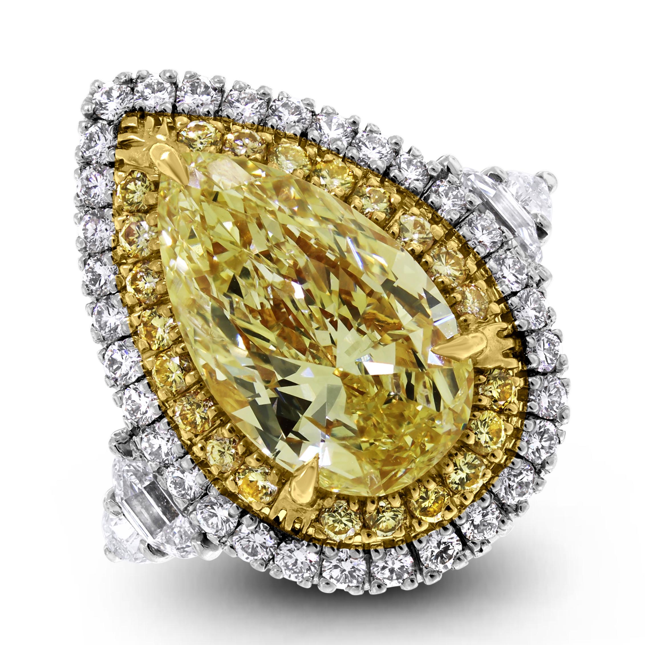 Big, bold and powerful, this statement yellow diamond ring is simply astounding.

Center Diamond Shape: Pear Shape
Center Diamond Weight: 8.85 ct 
Diamond Color: Fancy Yellow
Certificate: GIA 15678593

Side Diamonds Shapes: Round, Half Moon &