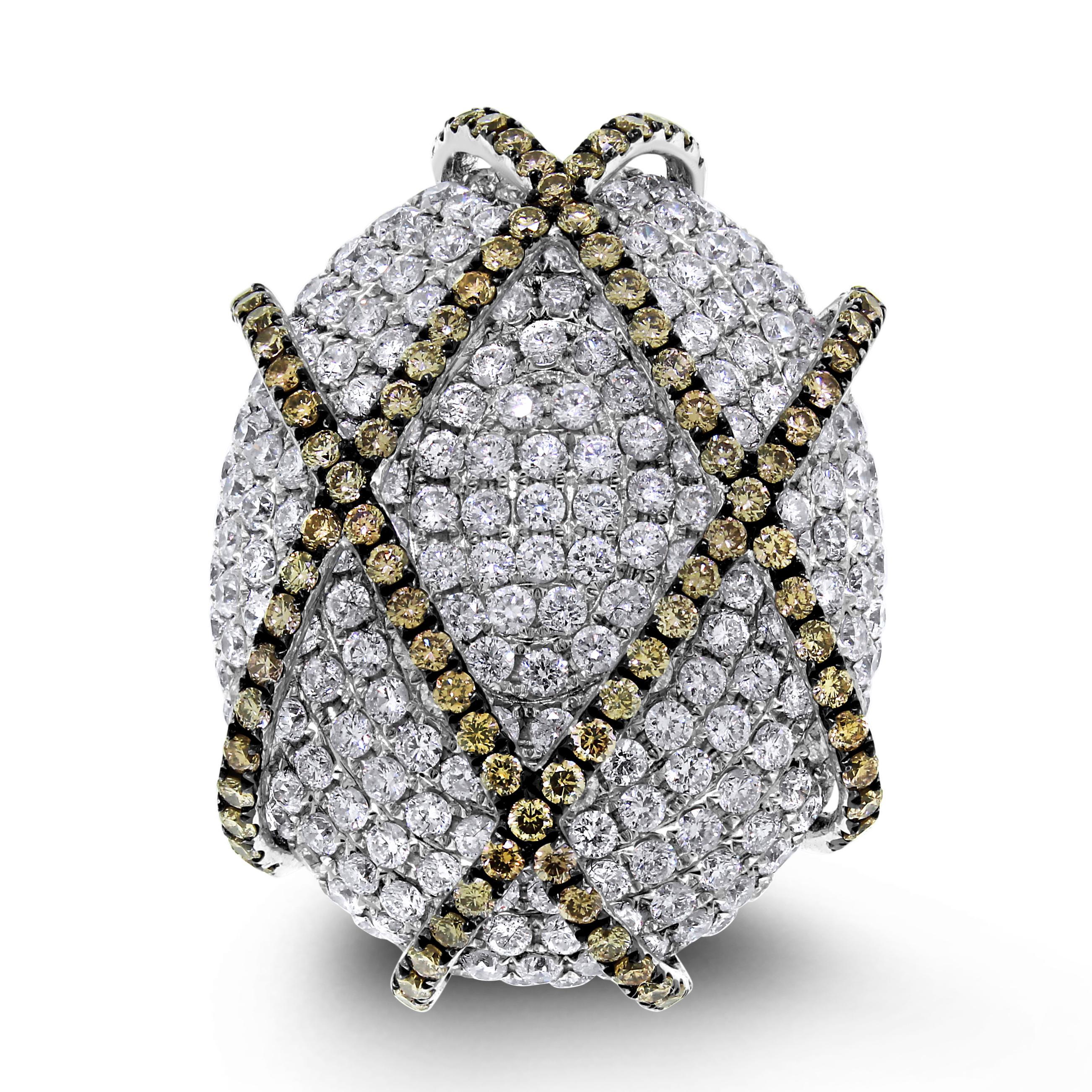 Bold & eye-catching, the Ivanka Ring is a stylish jewel with it extravagant size and allure. 

Diamonds Shape: Round 
Diamonds Weight: 1.25 ct & 4.65 ct 
Diamonds Color: Fancy Brown & F - G 
Diamonds Clarity: VS - SI (Very Slightly - Slightly