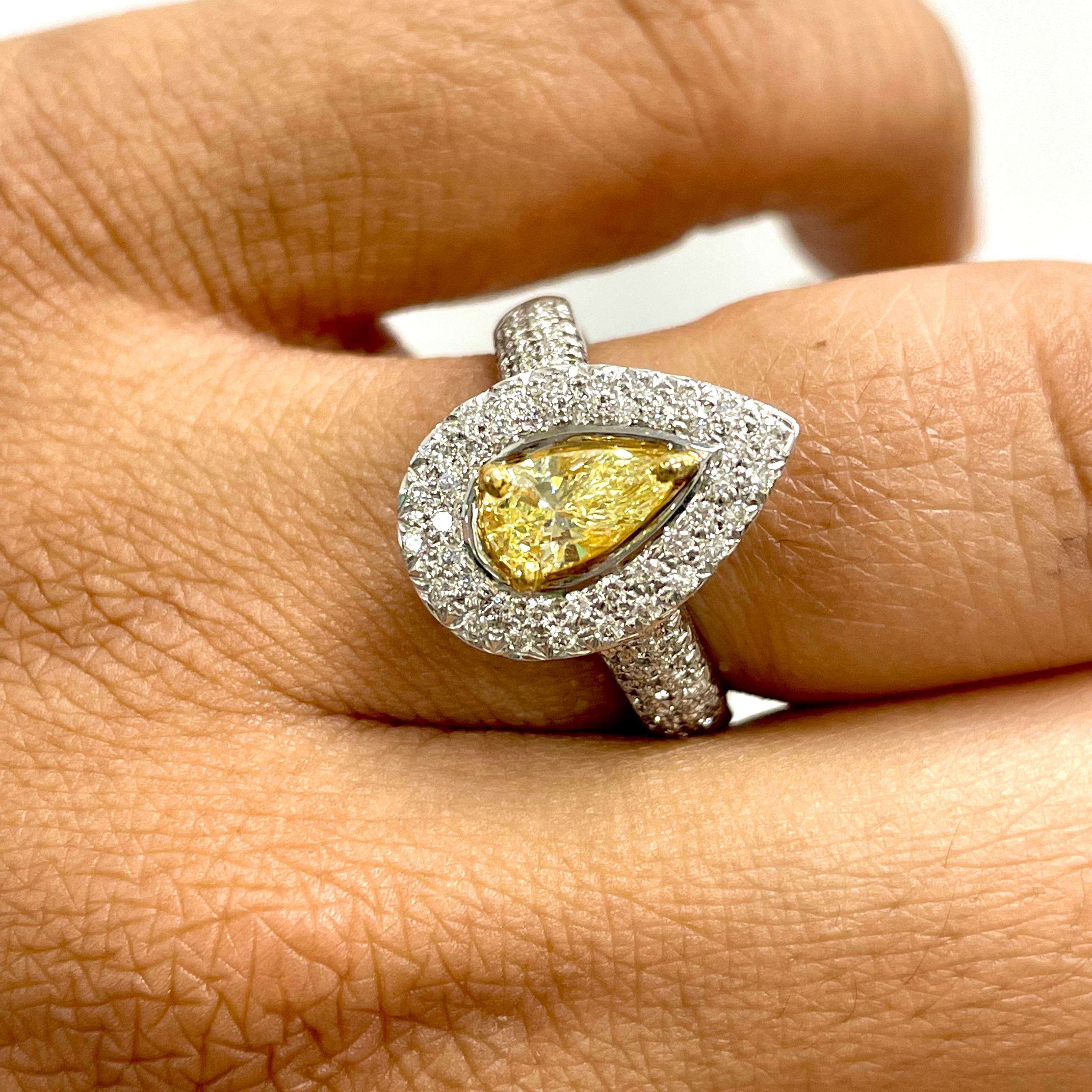 Radiant and luminous, the Luz Ring is ideal for all occasions featuring a stunning eye clean pear shape yellow diamond surrounded with a pave set halo and lovely diamond accents on the basket. 

Center Diamond Shape: Pear Shape
Center Diamond