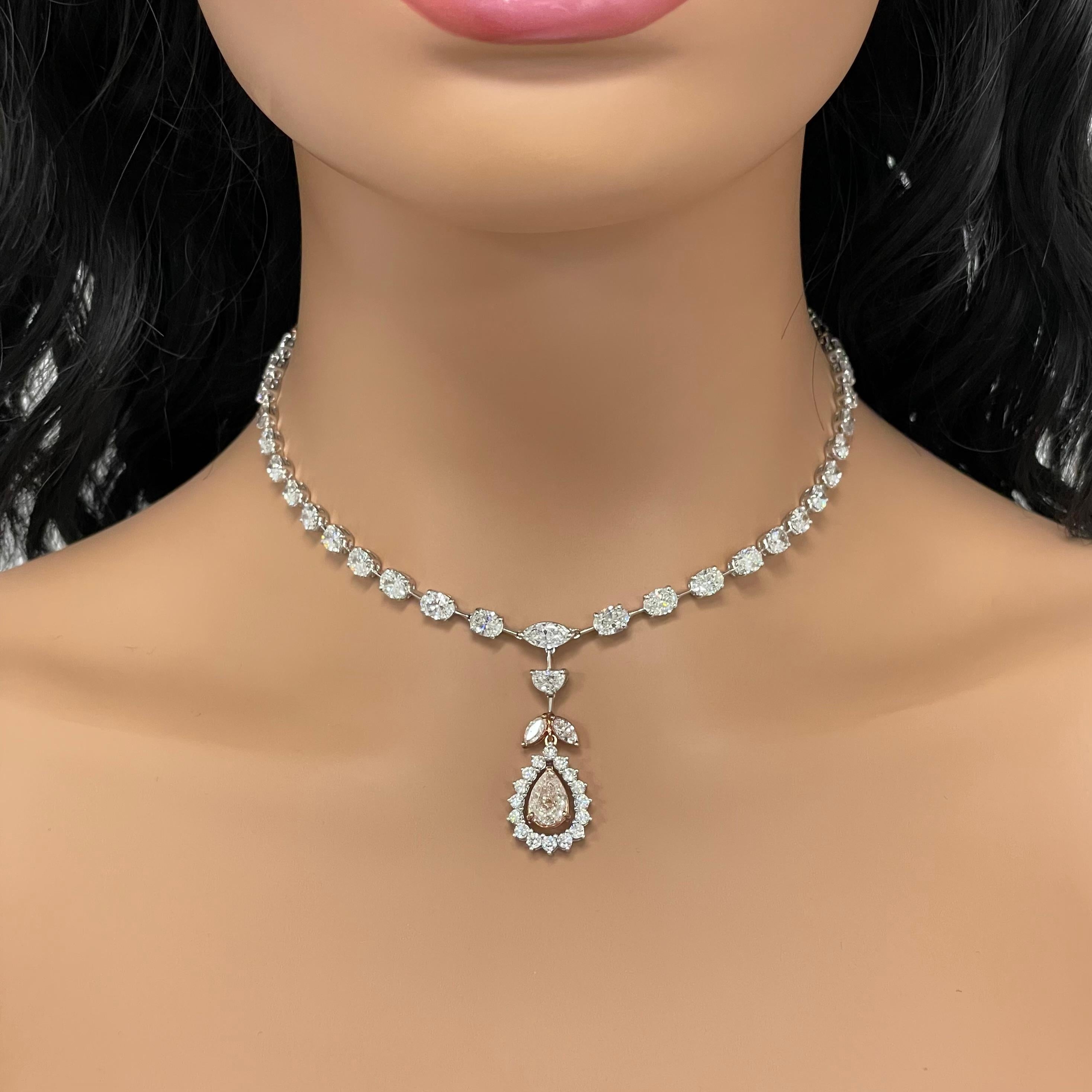 The Maira Diamond Necklace celebrates color diamonds. With a low color center that appears orangey pink in setting, the necklace showcases a pronounced string of solitaires that exude style and grace.

Diamonds Shapes: Pear Shape, Marquise, Oval,