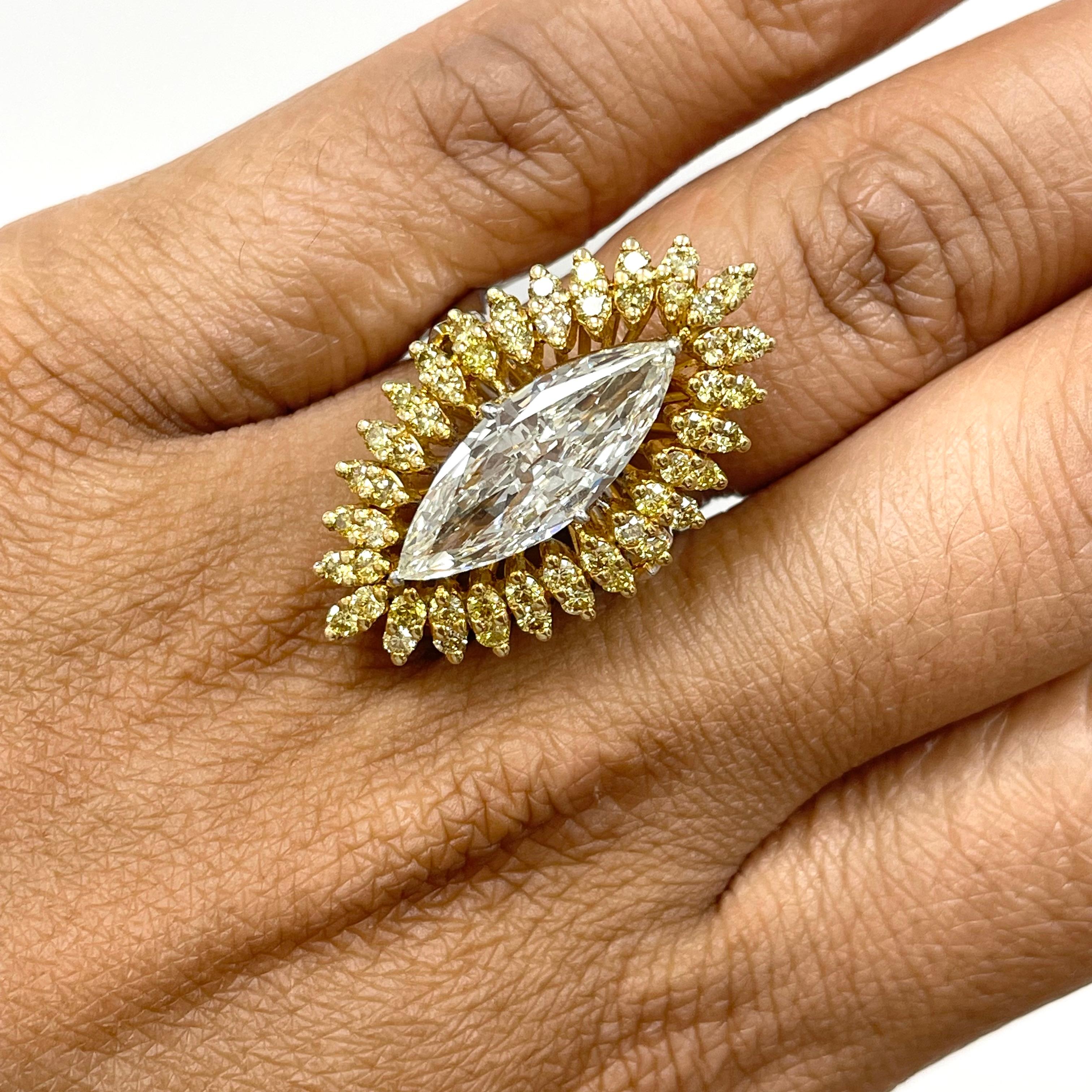 A elongated extra large Marquise (featuring measurements like that of a 3.5 - 4 carat) stunningly set with a double halo of round diamonds set to look like marquise diamonds, this ring is an absolute showstopper.

Center Diamond Shape: Marquise