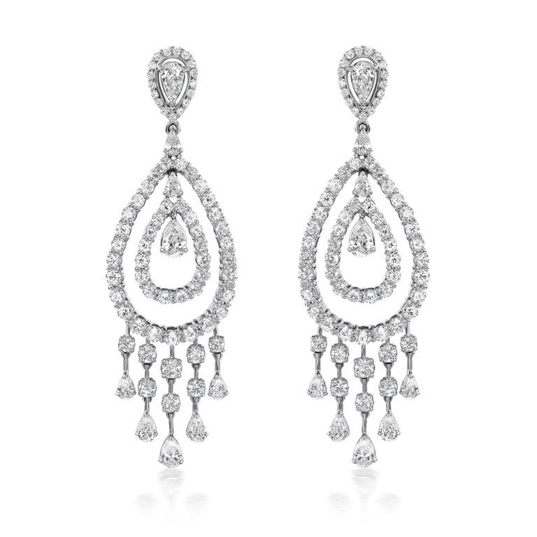 The Rain Diamond Earrings are a dazzling pair of statement chandelier earrings exhibiting all the movement and fun a rain drop encapsulates.

Diamonds Shapes: Pear & Round
Total Diamonds Weight: 15.01 ct
Center Solitaires: Pear Shape 1.95 ct (4
