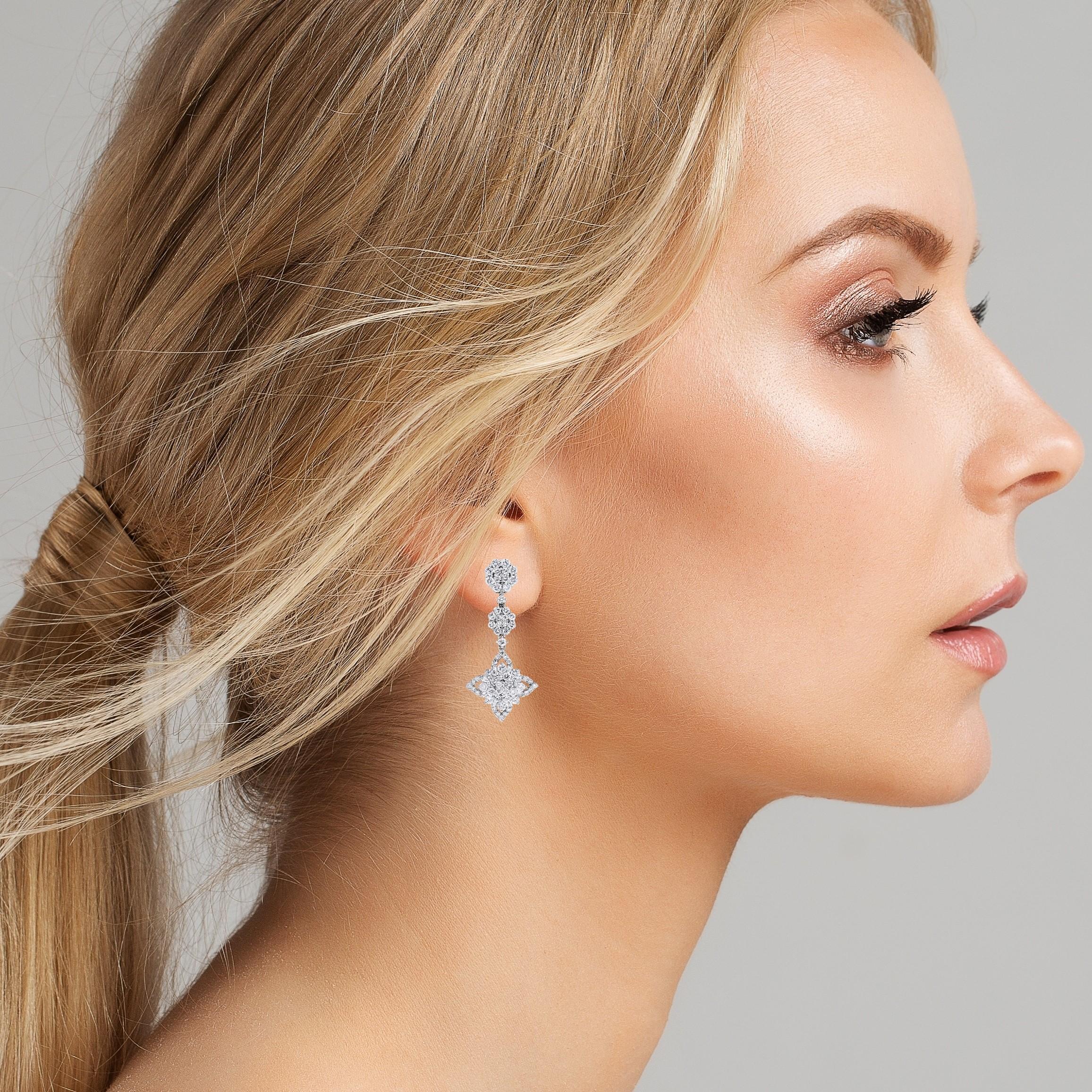 Sweet & spicy, these earrings are a versatile pair that can be worn for formal or informal events. They are chic, fun and flirty in the right measures.

Diamond Shape: Round & Baguettes 
Total Diamond Weight: 3.48 ct 
Diamonds Color: F - G 
Diamonds
