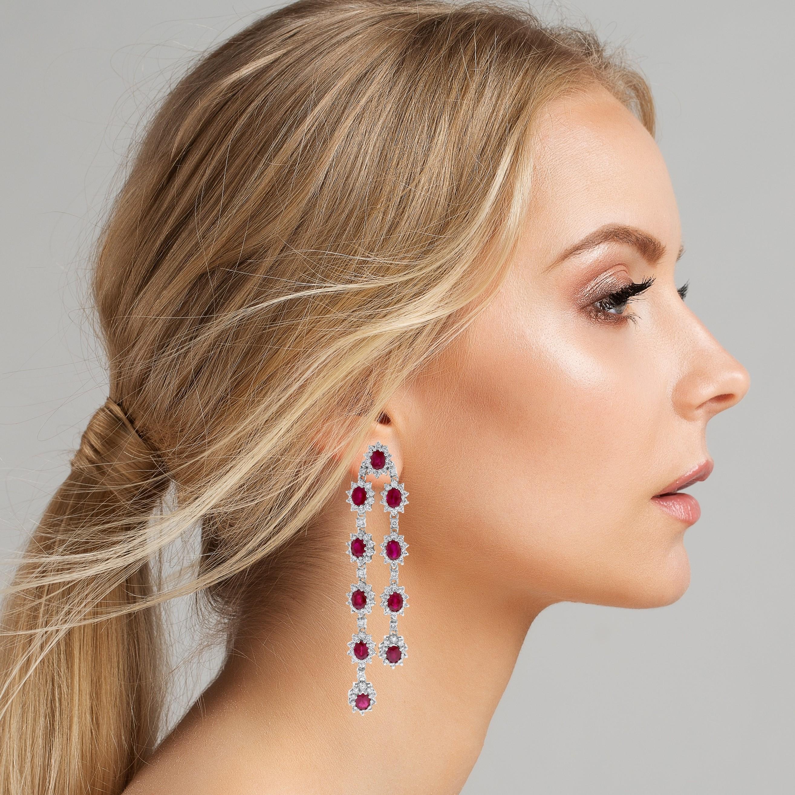 These Diamond & Ruby Earrings are a bold and elegant statement. Their imposing length and colors make them ideal for modern styling and appeal. 

Gemstones Type: Ruby 
Gemstones Shape: Oval 
Gemstones Weight: 9.73 ct 
Gemstones Color: Red 

Diamonds