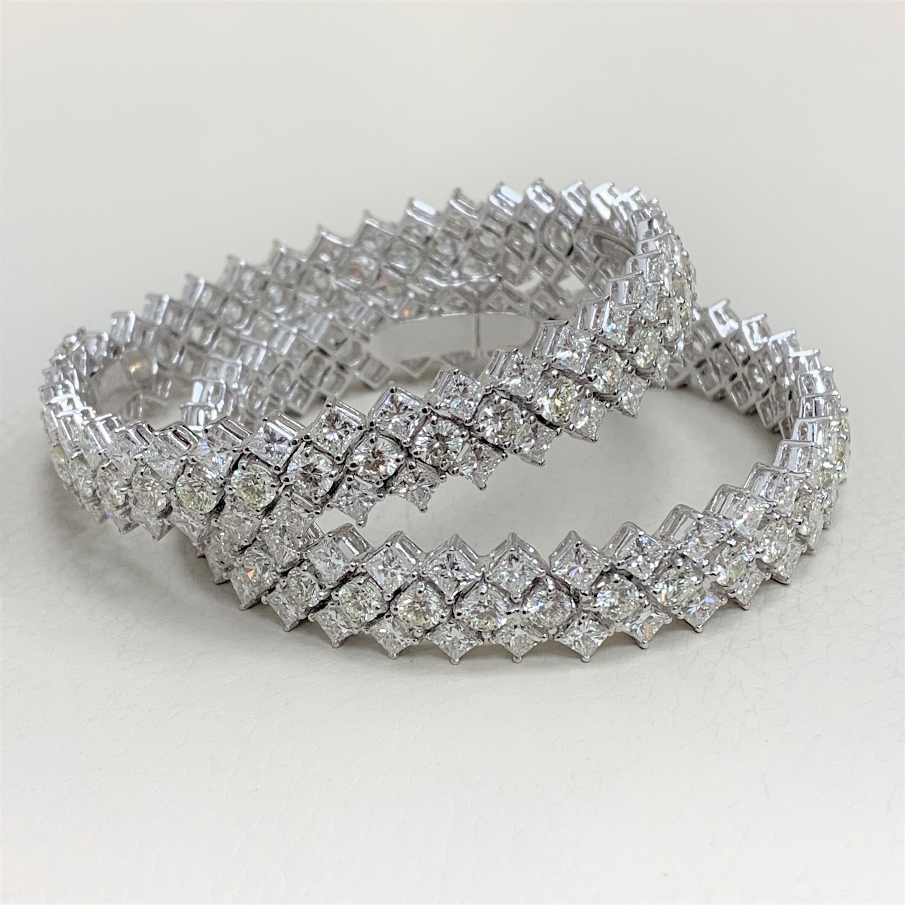 A lady that adorns herself with style, substance and resonance is truly deserving of the Grandeur bangles set. They are overstated, grand and unapologetic. 

Diamonds Shape: Round & Princess 
Total Diamond Weight: 53.75 ct 
No. of Diamonds: 216