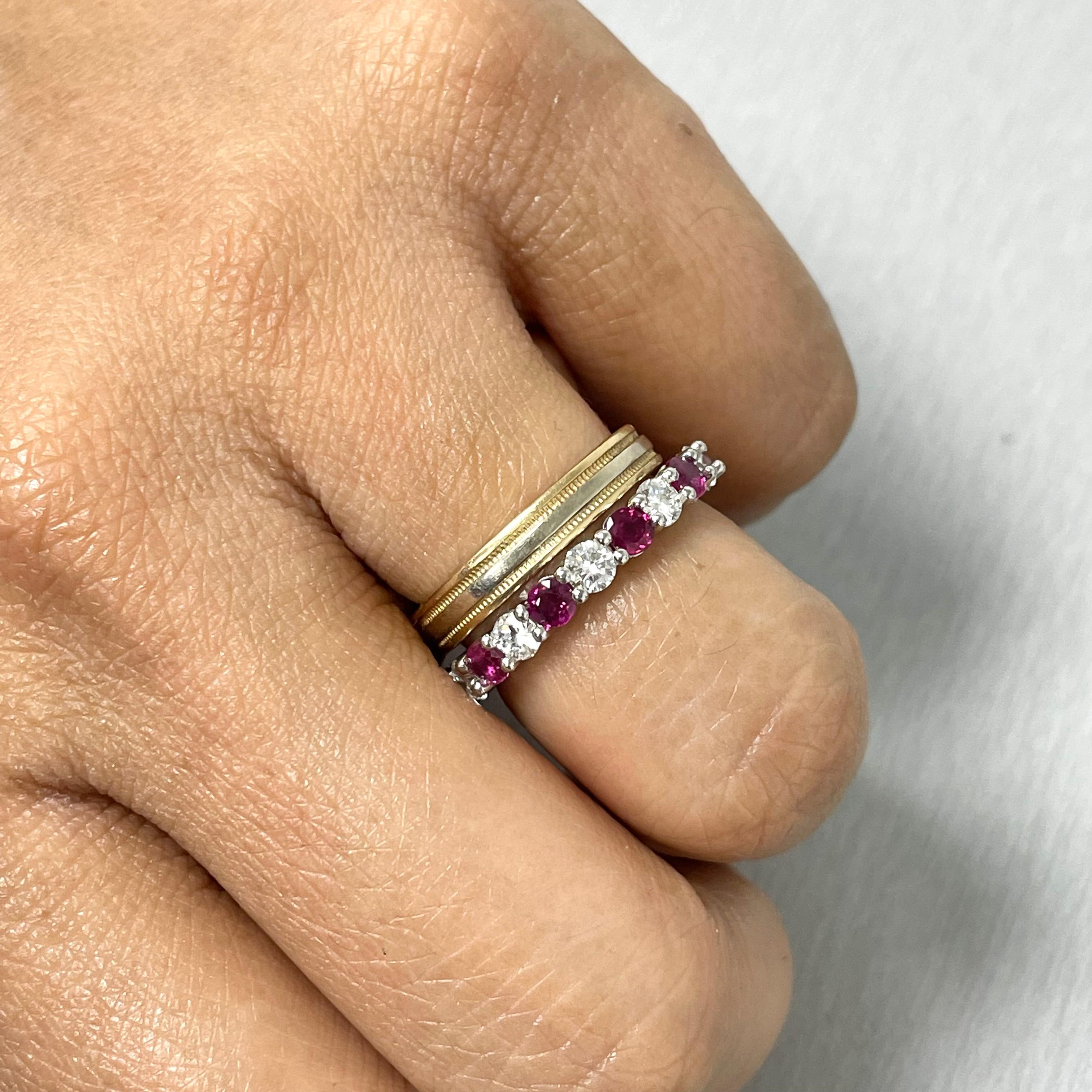 The Ruby and Diamond Almost Eternity is the perfect stacking band to add color and luxe to your ring collection. It is vibrant and feminine while being bold and sensual. This almost eternity features 9 diamonds and 10 rosy rubies with about 5 mm of