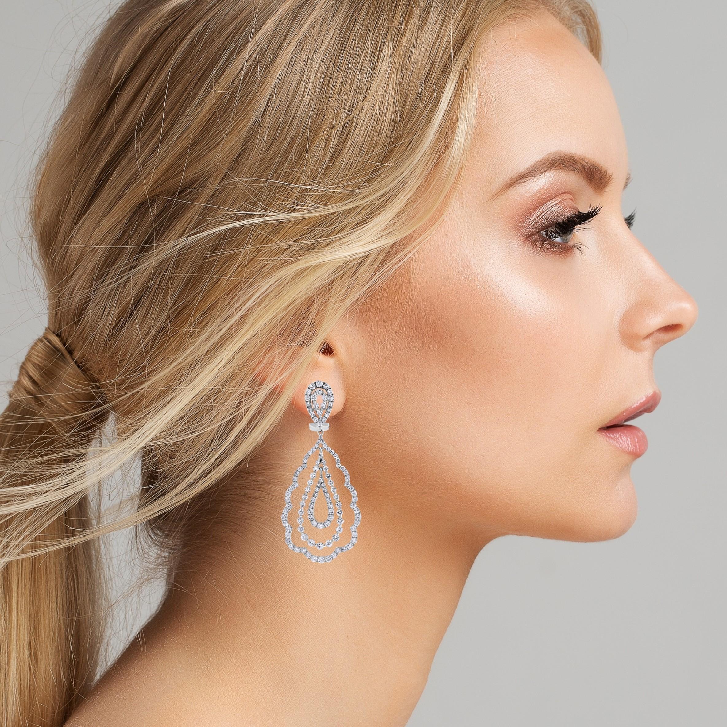 The Sabrina earrings are a expression of classic design. They exude elegance and luxury in a appealing combination and are a pair for any design and jewelry lover to covet.

Diamond Shape: Round 
Total Diamond Weight: 6.04 ct 
Diamonds Color: F -