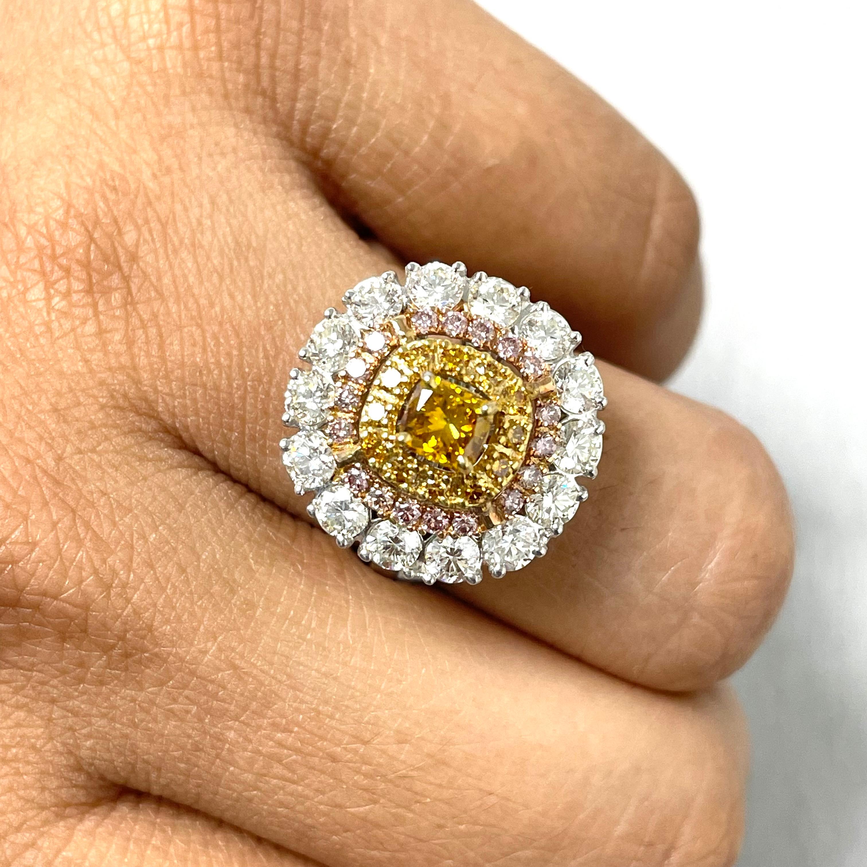 The Sun Diamond Cocktail Ring is a stunning ball of fire with its yellow orange center and concentric halos of orange, pink and white diamonds. It is a absolute showstopper.

Center Diamond Shape: Radiant
Center Diamond Weight: 0.53 ct 
Diamond