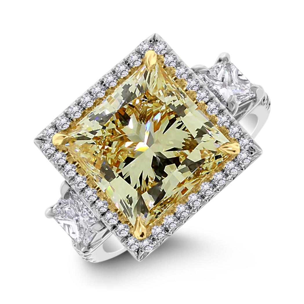 Creatively crafted to enhance the color of the center diamond and offer our clients a bargain for a large fancy yellow solitaire diamond ring, the Sundance Ring is dazzling and captivating.

Center Diamond Shape: Princess Cut 
Center Diamond Weight:
