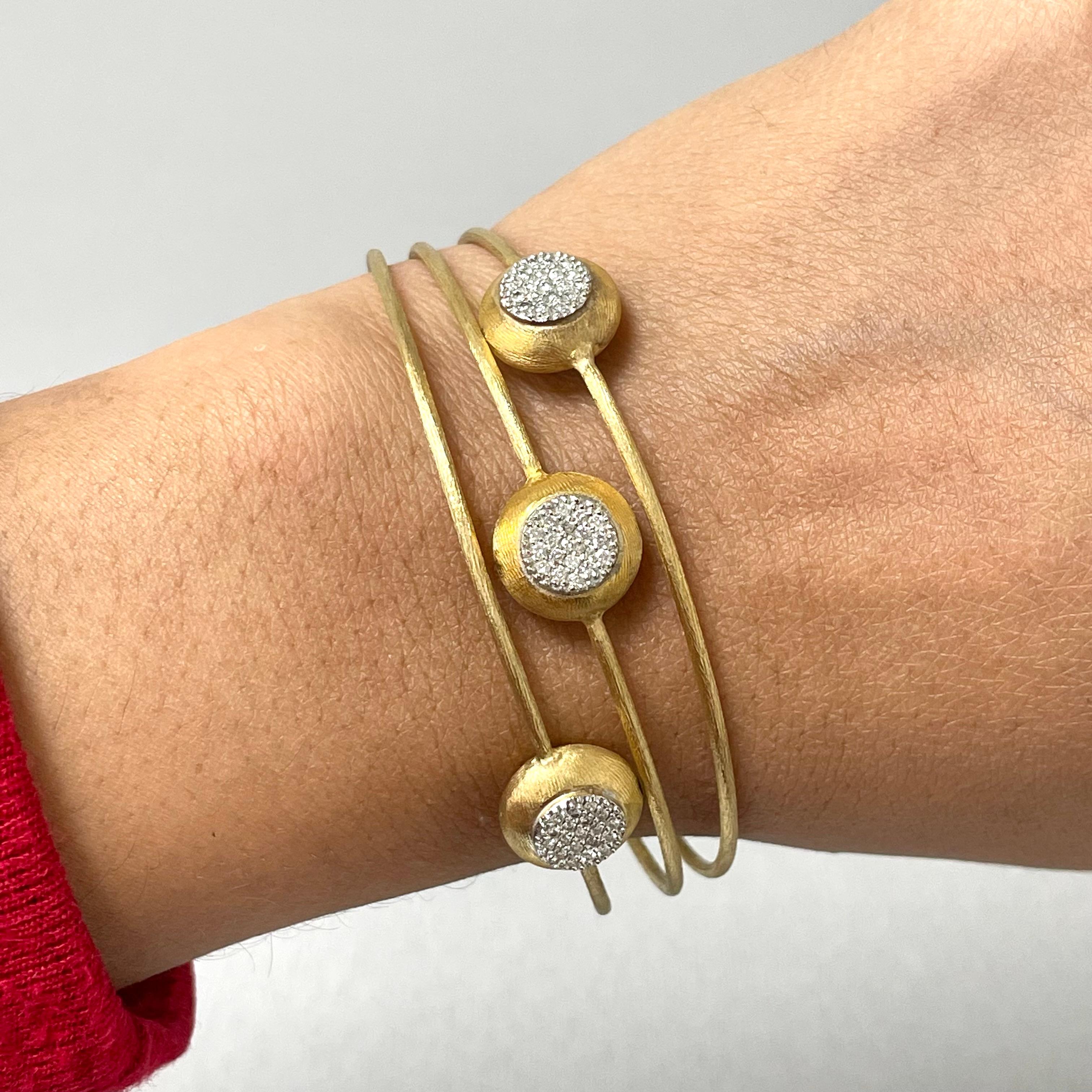 The Trinity Bangles have a unique metal styling giving them the feel of something antique or classical yet modern. They combine bold and delicate elements into a elegant piece of jewelry. 

Total Diamond Weight: 0.43 ct 
Diamond Color: H - I