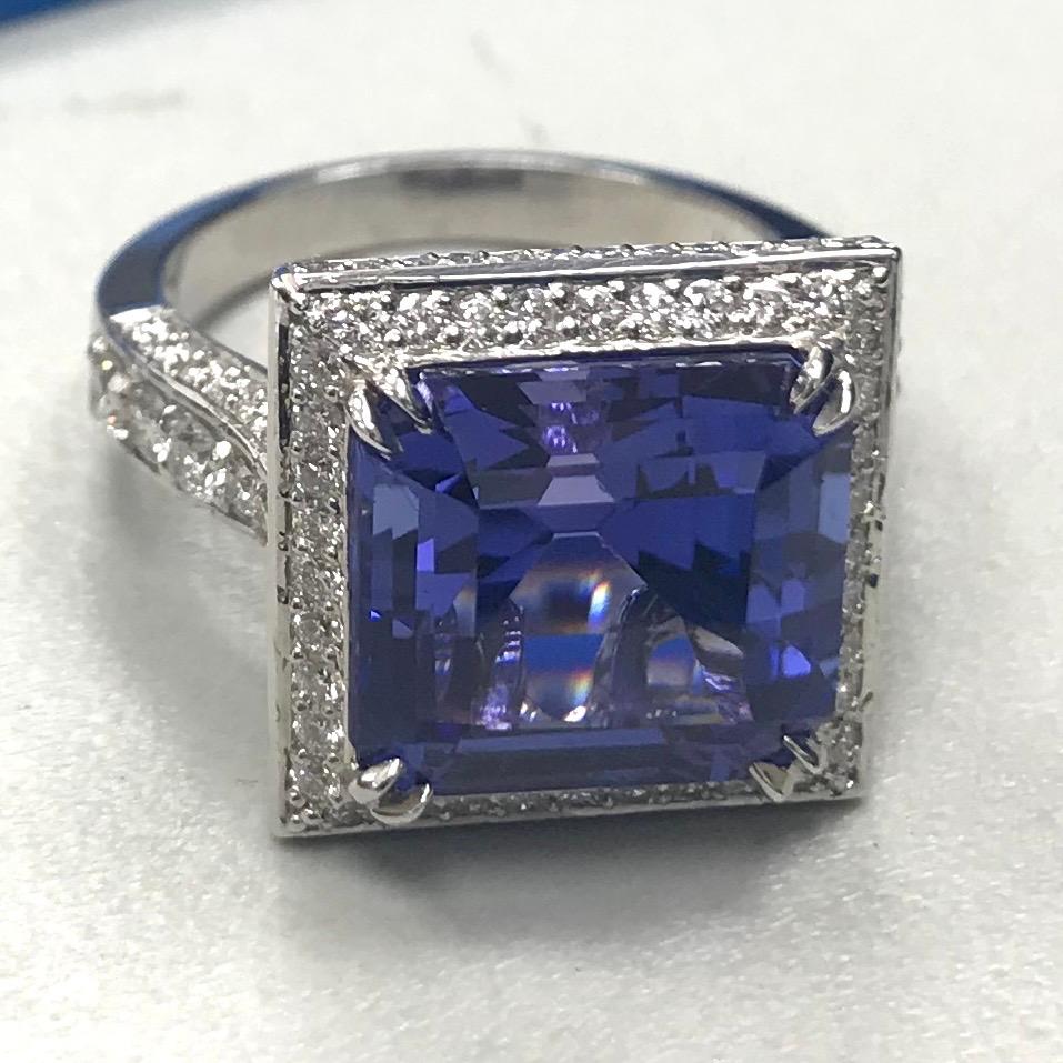 This stunning Tanzanite bewilders the eye by appearing blue and violet simultaneously. Its large size and gracious ring design make it mesmerizing and captivating. 

Gemstones Type: Tanzanite 
Gemstones Shape: Square 
Gemstones Weight: