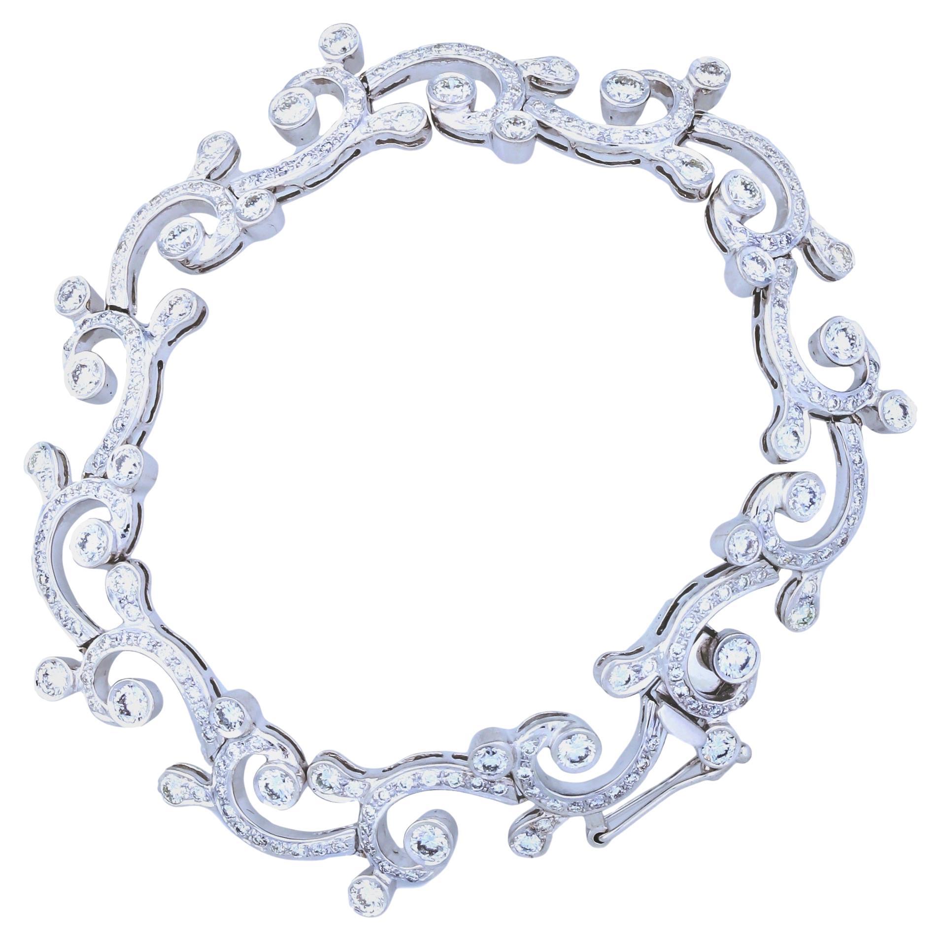 With elegant curves, the Waves & Tides Bracelet sweetly adorns one's wrist and accentuates femininity. The sparkling diamonds set in white gold bring radiance to one's aura.

Diamonds Shape: Round
Total Diamond Weight: 5.99 ct
Diamond Color: G -