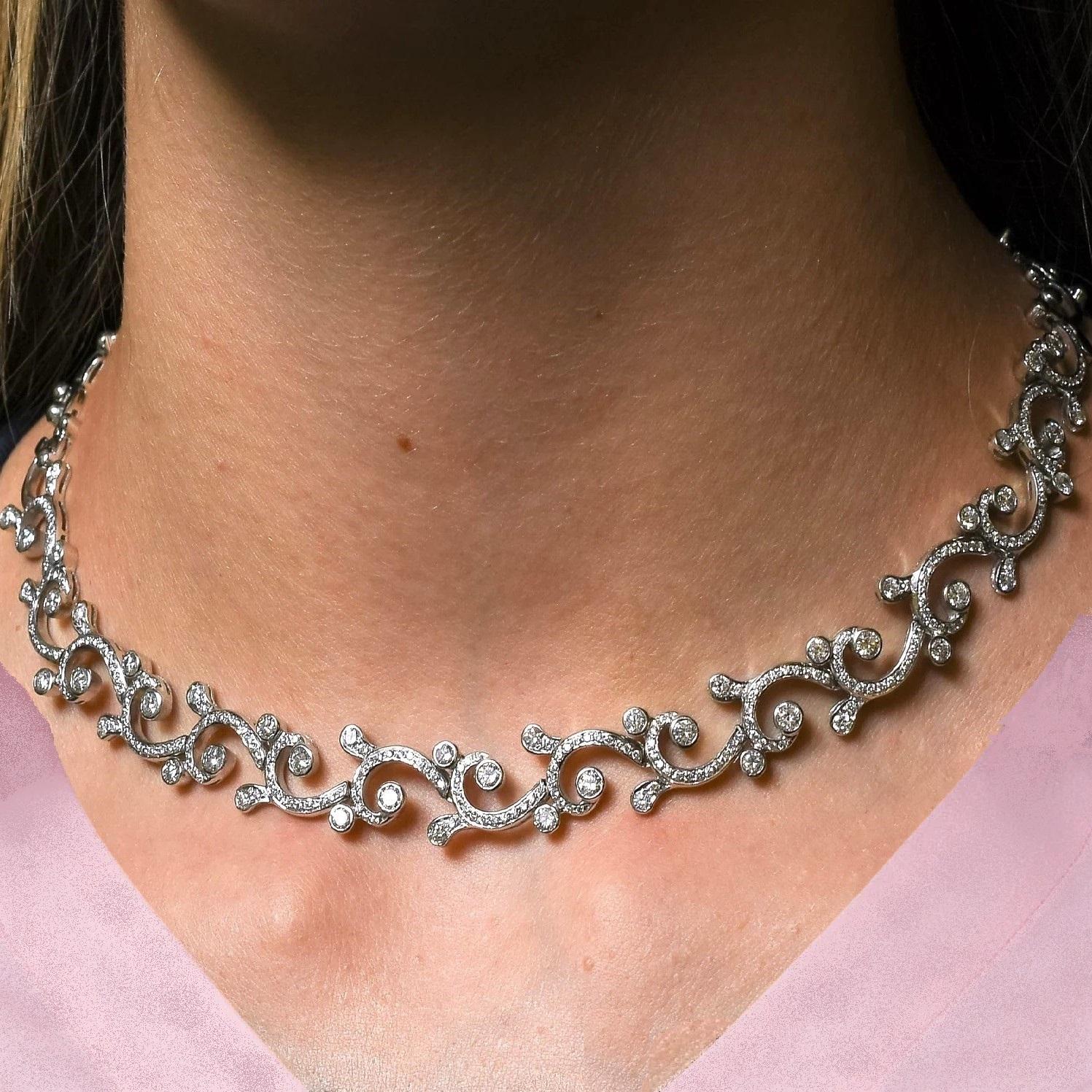 With elegant curves, the Waves & Tides Necklace sweetly adorns one's neck and accentuates femininity. The sparkling diamonds set in white gold bring radiance to one's aura. 

Total Diamond Weight: 12.16 ct 
No. of Diamonds: 420 
Diamond Color: G -