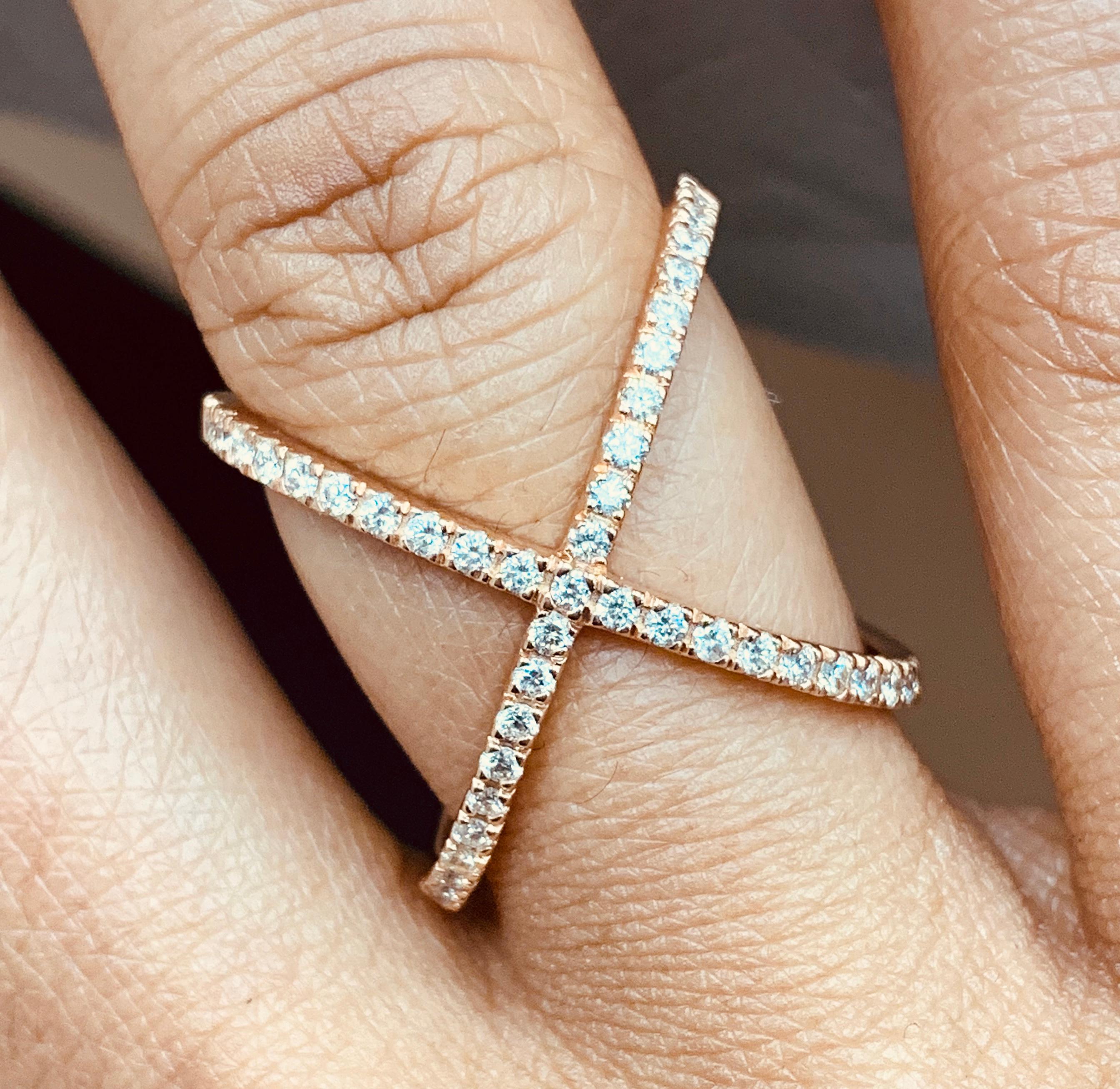 This thin pave set diamond cross is both chic and trendy. 

Diamonds Shape: Round 
Total Diamonds Weight: 0.53 ct 
Diamonds Color: H - I 
Diamonds Clarity: VS (Very Slightly Included) 

Metal: 14K Rose Gold 
Metal Wt: 4.29 gms 
Setting: Pave Set