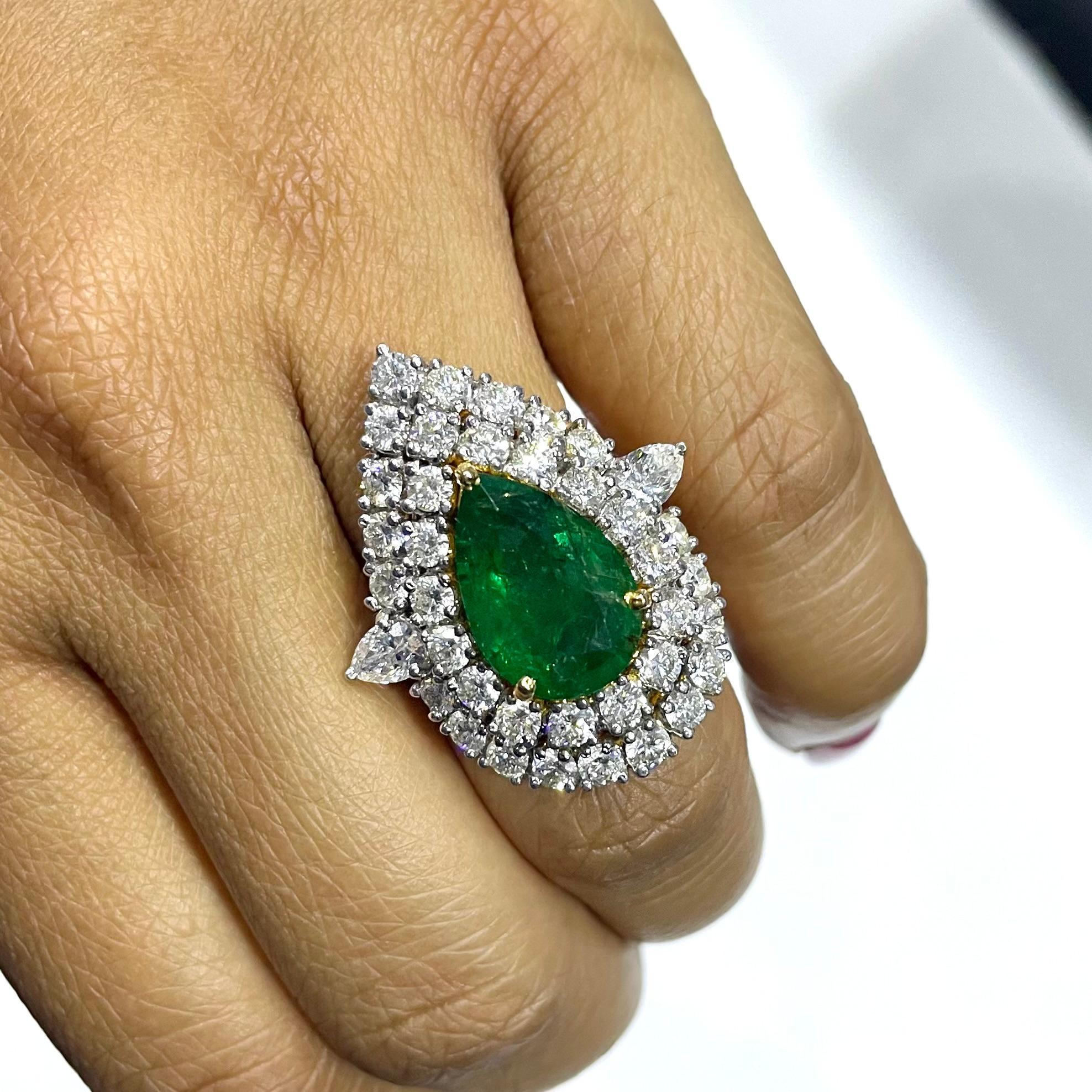 An impressive stated Pear Shape Emerald Ring to capture the attention of and dazzle the onlooker, the Yana ring is bold, sexy and stylish. With a natural deep green emerald at its core, surrounded by 2 rows of bright diamonds, the ring is
