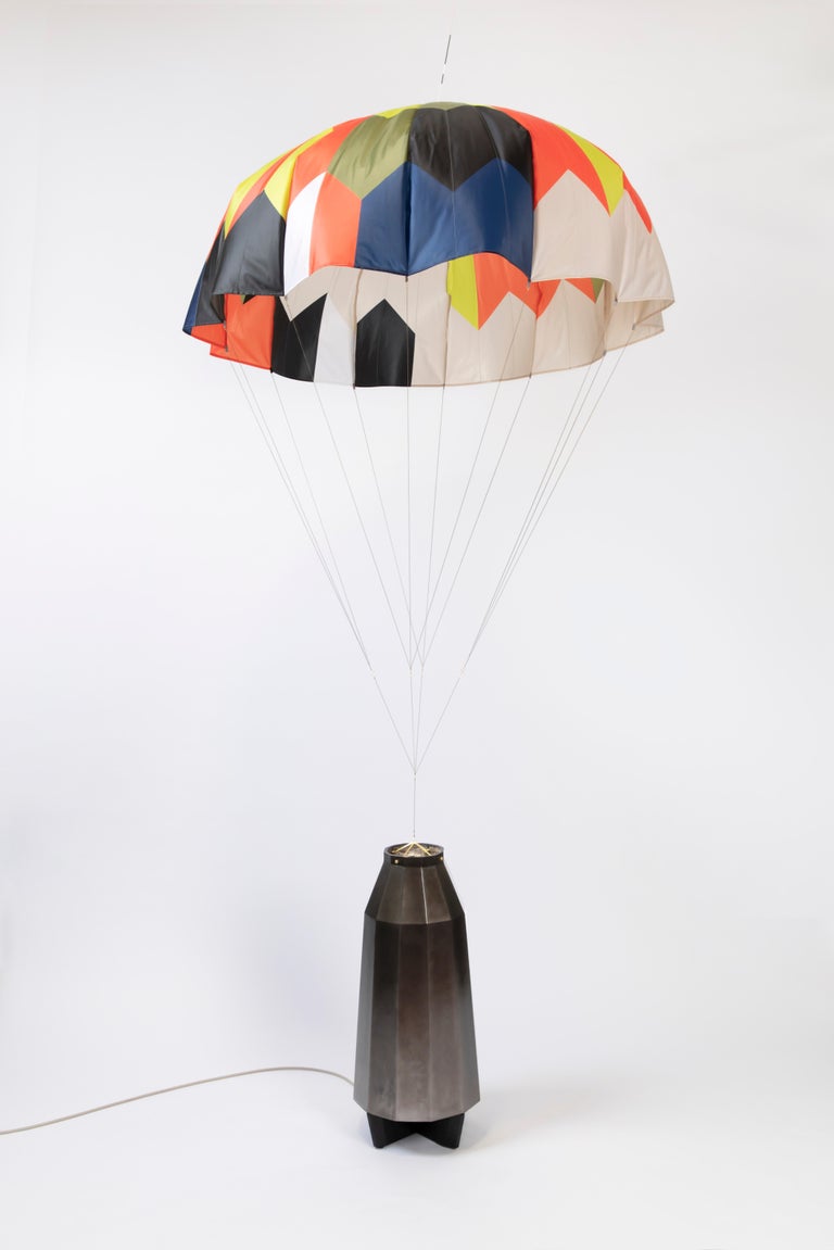 From acclaimed lighting designer Bec Brittain, a new series of dynamic, whimsical lighting forms that mimic the rhythm of flowers in the wind.

Taking cues from the movement of inflated parachutes–specifically, those used by NASA during wind