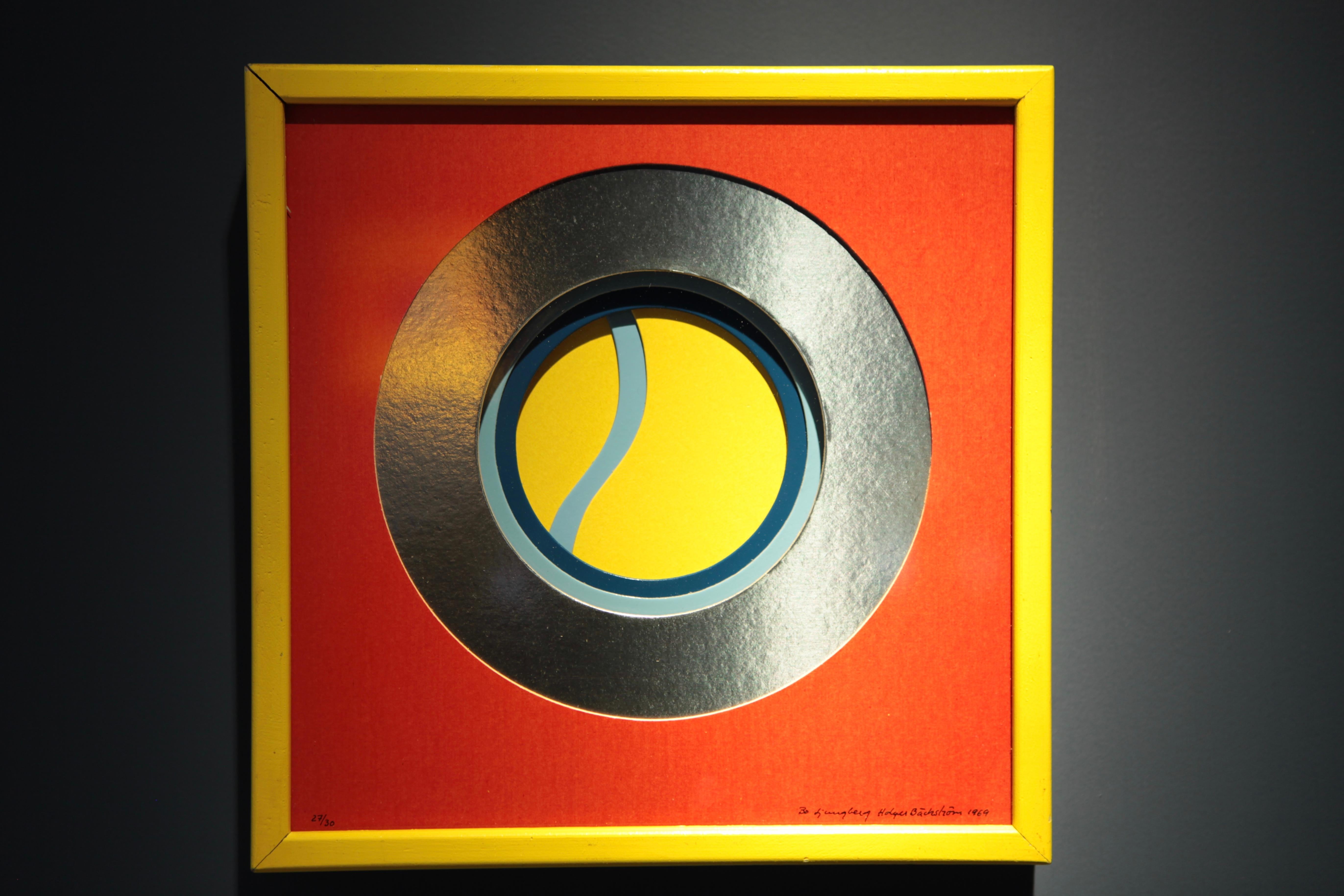 An original multiple by Swedish Designers Beck & Jung (Holger Bäckström & Bo Ljungberg).
Colored cardboard, yellow wooden frame.
Signed Holger Bäckström and Bo Ljungberg 1969.