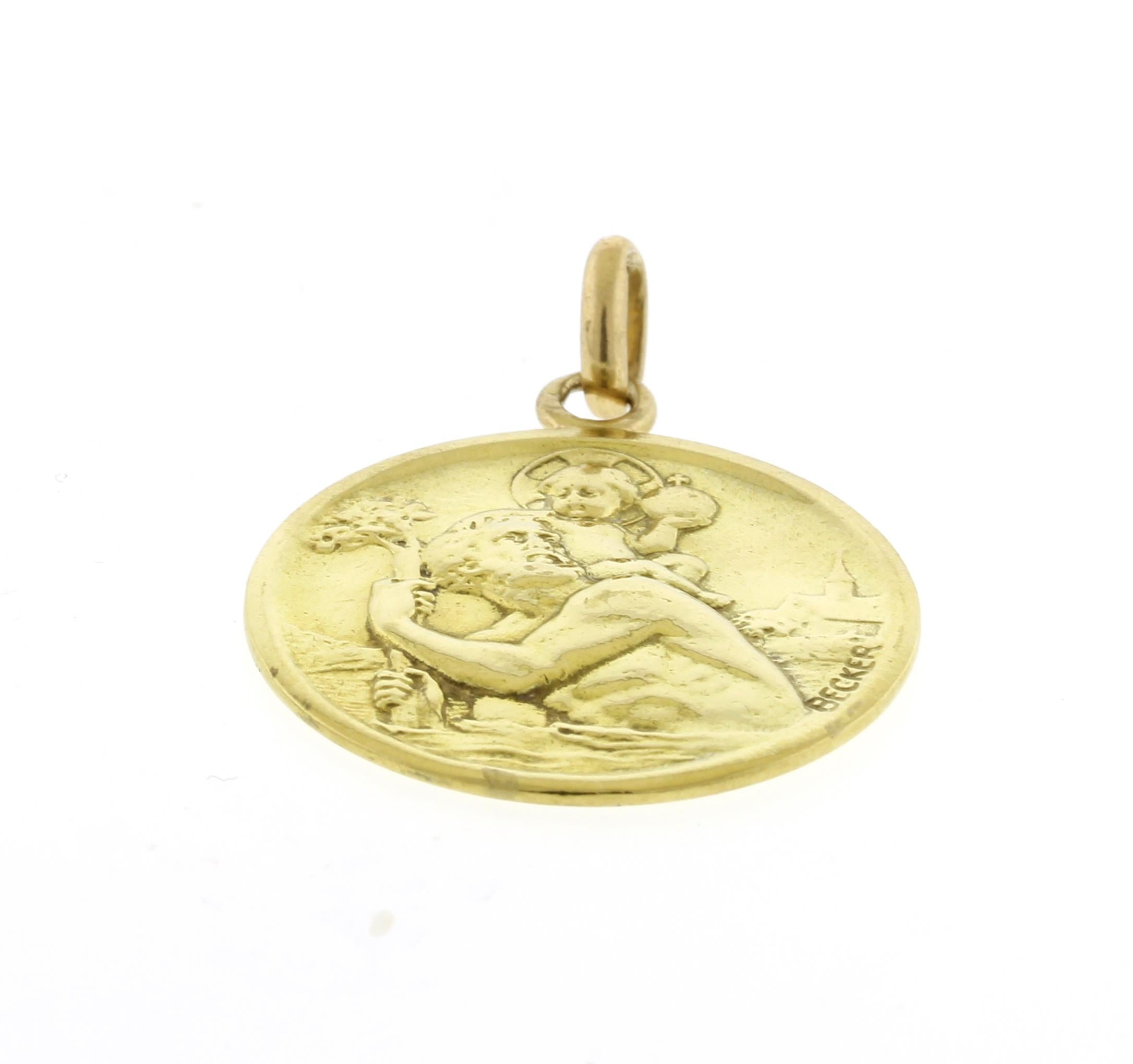 This 18kt gold pendant shows St. Christopher crossing the water with Jesus on his shoulder.  The jeweler was Edmond-Henri Becker, he was born in France in 1871.
• Designer: Edmond Henri Becker
• Metal: 18kt Yellow Gold
• Circa: 1950s
• Diameter: