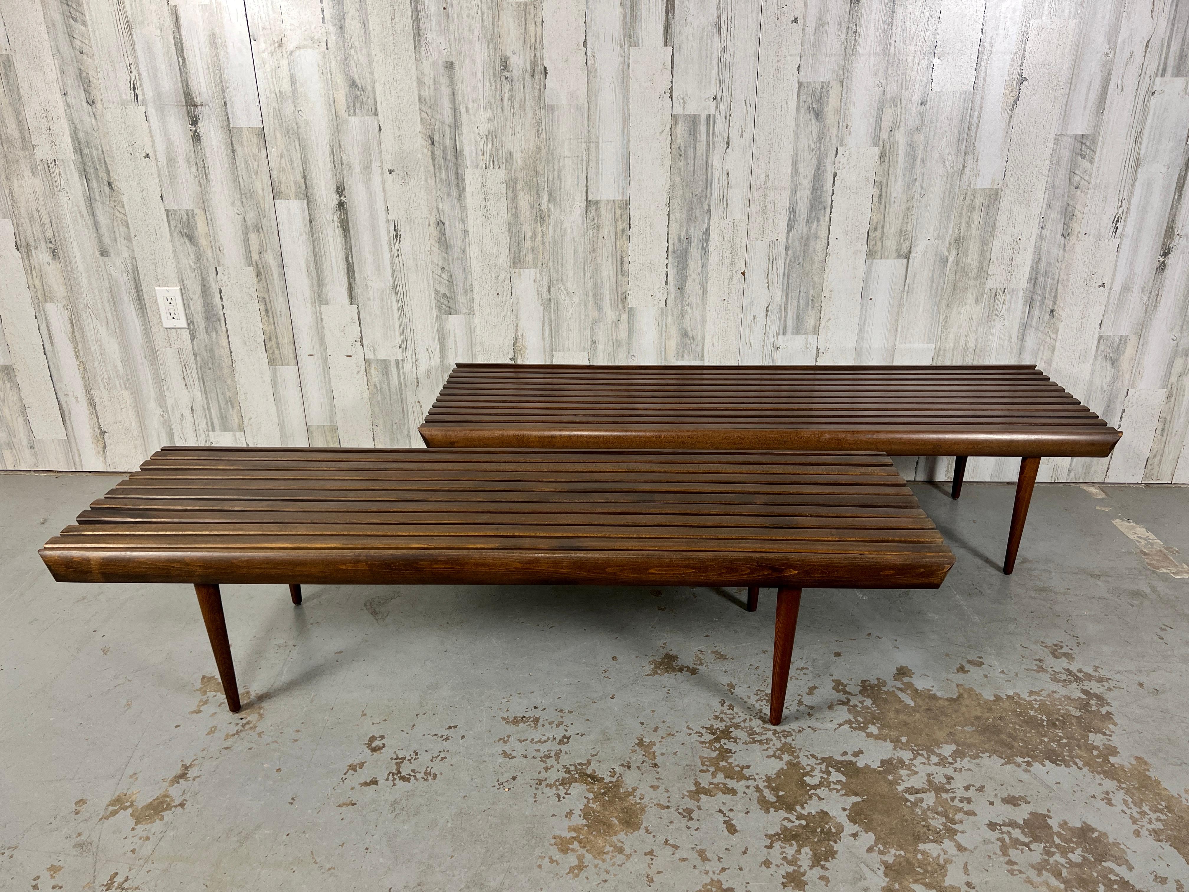Two Mid-century slat wood benches similar in size, one has 9 slats and the other has 10 slats, great for under a window or to be used as a coffee tables. all original condition.

1. 60