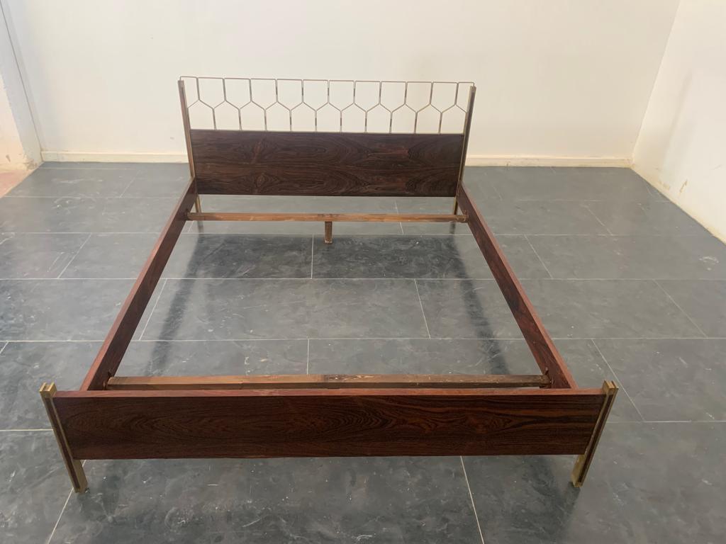 Double bed by Carlo de Carli for Sormani, 1960s. I have official proof of authenticity such as period catalogues, design documents or other literary sources and take full responsibility for any authenticity issues arising from misattribution. Patina