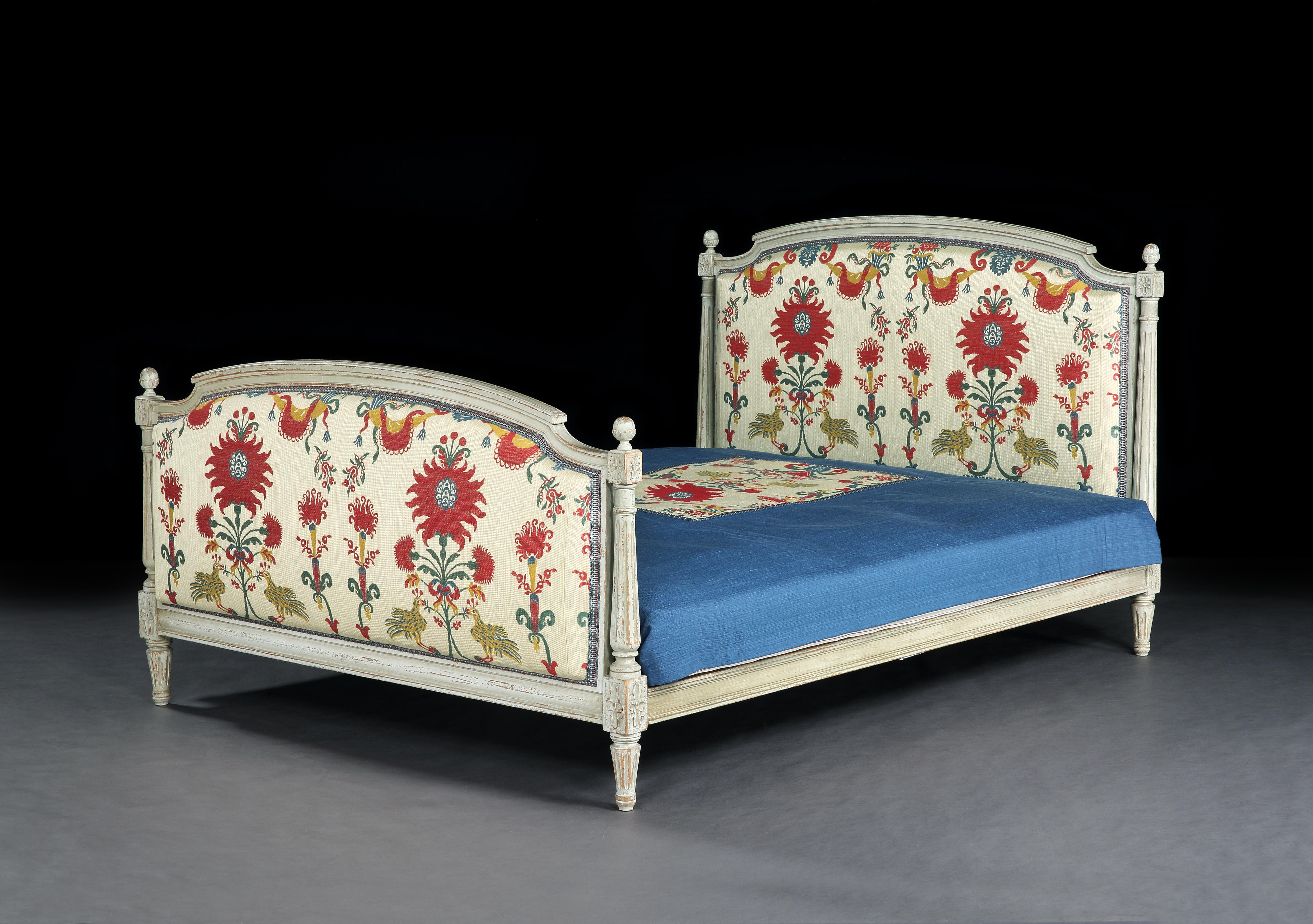 Louis XVI, carved & painted, double bed upholstered with susani, woven textile with flowers & lovebirds & custom made bedspread, sold with custom made box spring mattress base and king-sized sprung mattress 150cm, 5ft Wide

- The headboard and