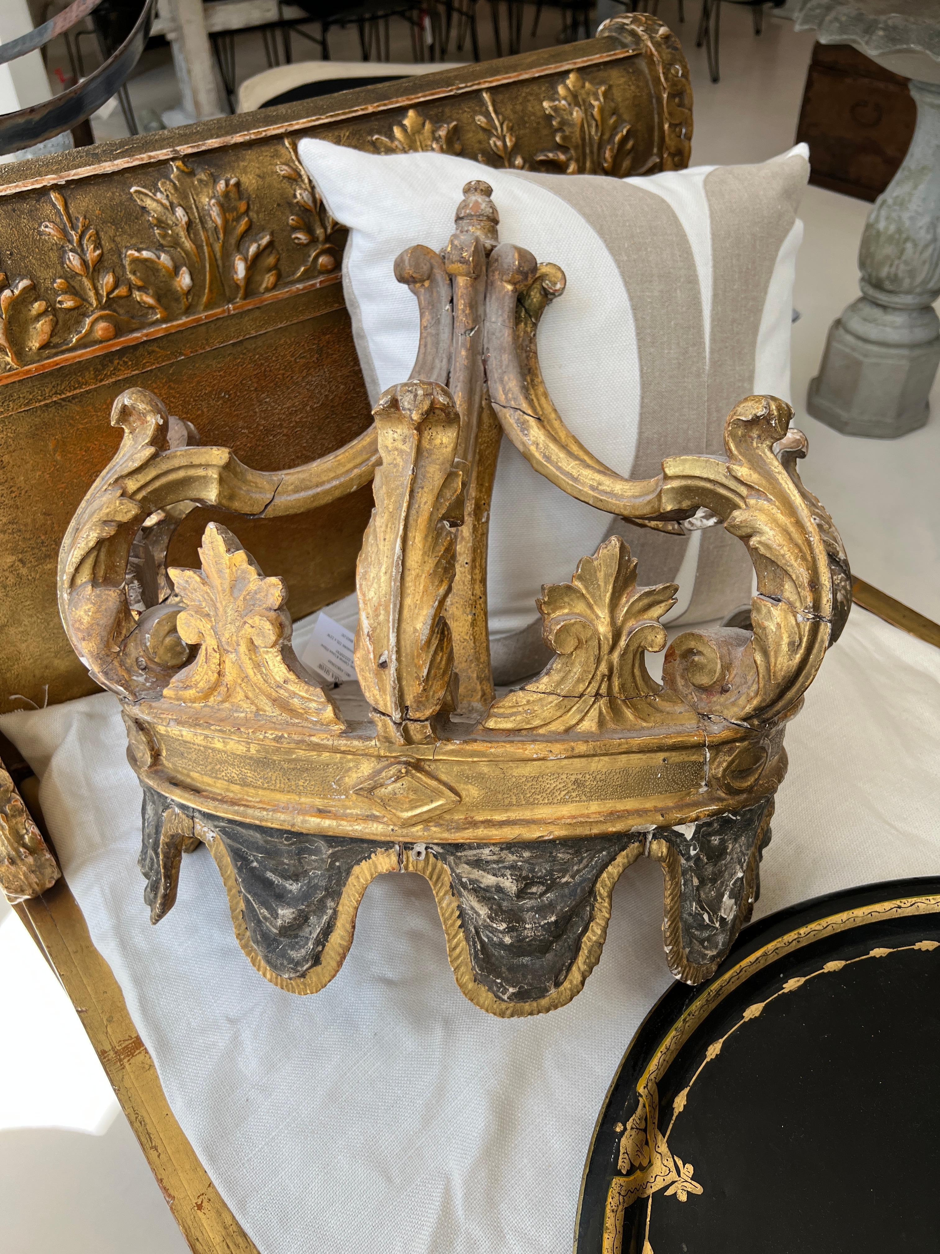 Very rare wooden crown for mounting over a bed with curtains added. This crown has a carved draping effect at the bottom that provides another level of opulence.