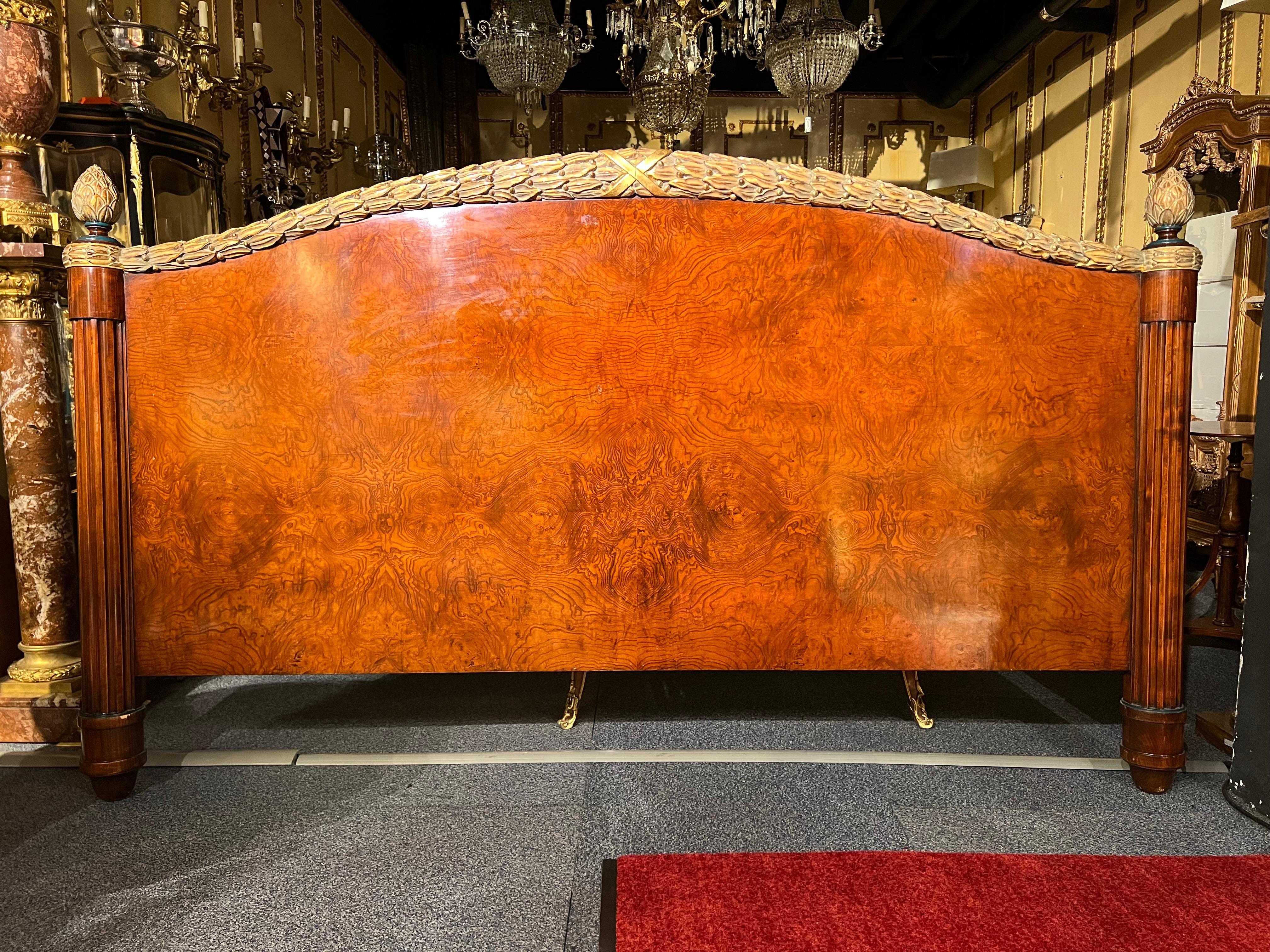 Bed headboard from a suite of the Viennese 5 star hotel in louis seize style.
Solid wood carved with root veneer.
Framed with beautiful laurel wreath carvings with Poliment gilding.
