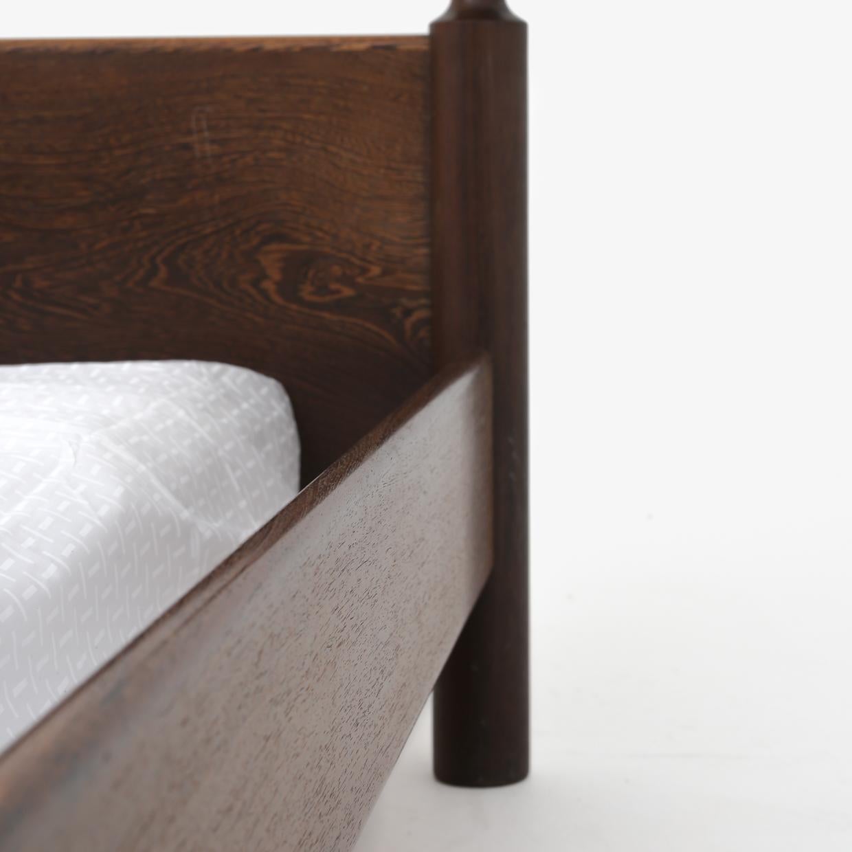 Bed set in solid wenge consisting of a double bed, two bedside tables and two matching stools from the 1950s.