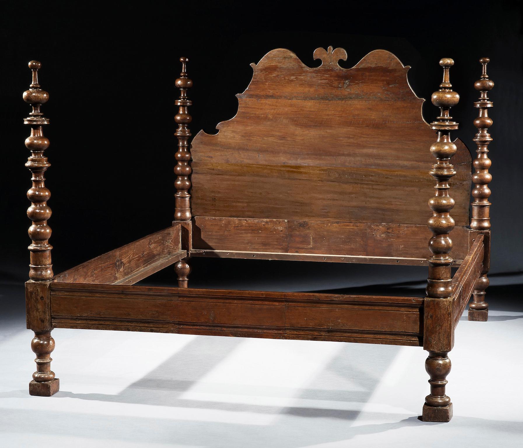 The shaped bedhead with a central fleur-de-lys. The four boldly turned posts joined by square stretchers. Most likely Tuscan.

Measures: 184cm 72in wide, 213cm 83½indeep, 150.5cm 59.25in high

Provenance: Count and Countess Martignone. Avid